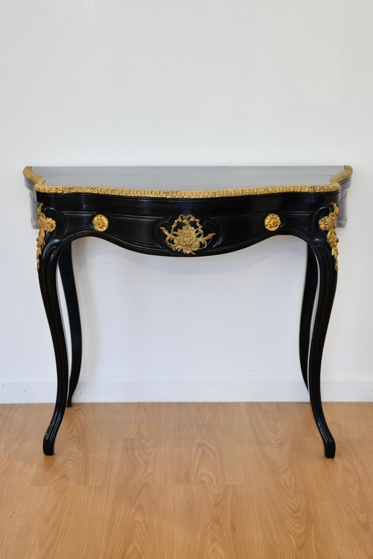 Alexander Roux ebonised and bronze mounted games table with label on base, circa 1870. Dimensions: 29