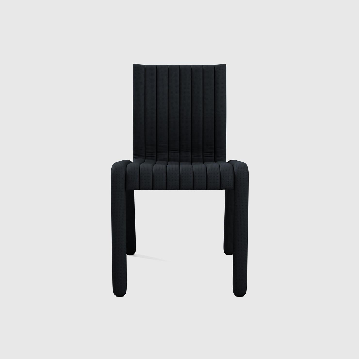 The Alexander Street side chair by Philippe Malouin evokes the leather sports seats of iconic sports cars of the 1980s he grew up with on Alexander Street in Montreal. Ribbed and perforated leather is handstitched over the entire piece. The sturdy