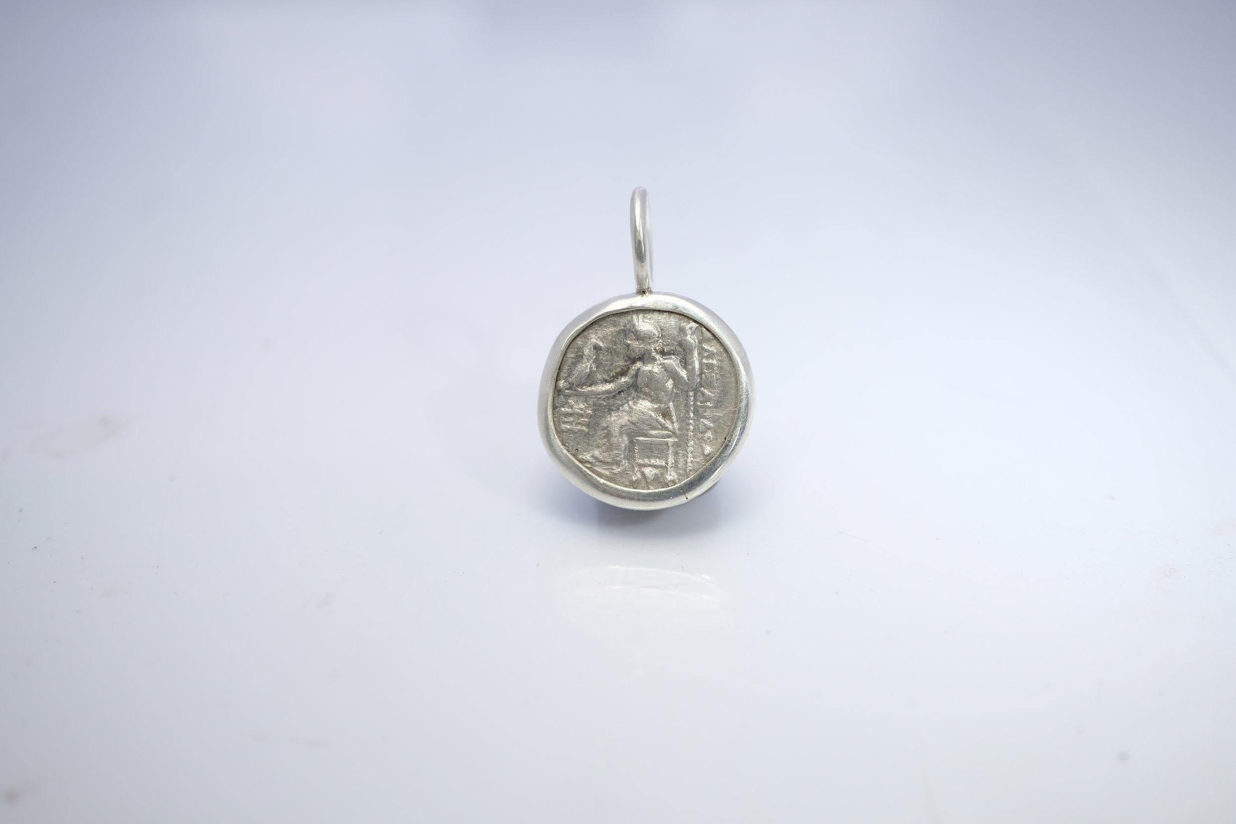 Stunning coin with great imagery of Hercules and Zeus. The pendant measures about 18 mm in width and about 23 mm from the top of the bail to the bottom of the coin. The only similar coin I set on Etsy (set as pendant) is set in a non-handmade