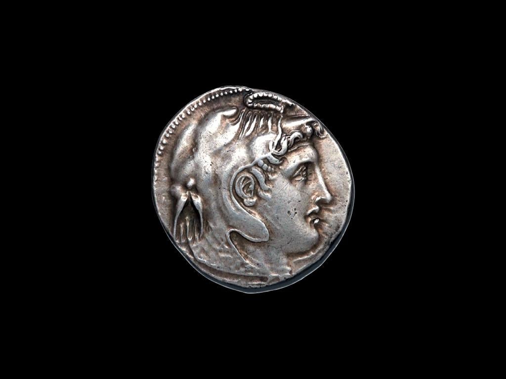 KINGDOM OF EGYPT Ptolemy I (323-318 BC) Silver Tétradrachme.
Head of Alexander the Great right, horned and wearing elephant skin.  Reverse show AΛEΞANΔPOY, Athena Alkidemos striding right, with raised spear & shield, a Corinthian helmet above the
