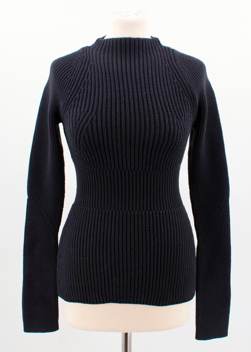 Alexander Wang black cotton blend knitted jumper

Featuring:
-long sleeves
-fitted silhouette
-rib knit
-straight hem
-stretch material

Condition: 9.5/10
Measurements are taken laying flat, seam to seam. 

Approx.
shoulders: 36cm
bust: 29cm
length: