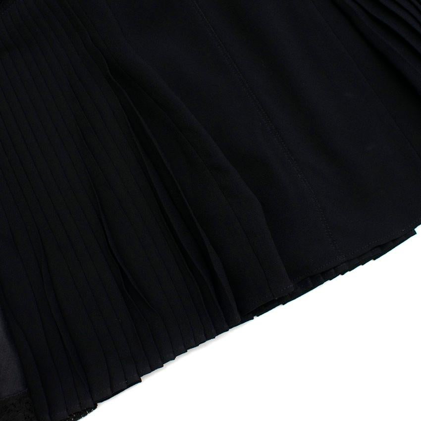 black dress with pleated skirt