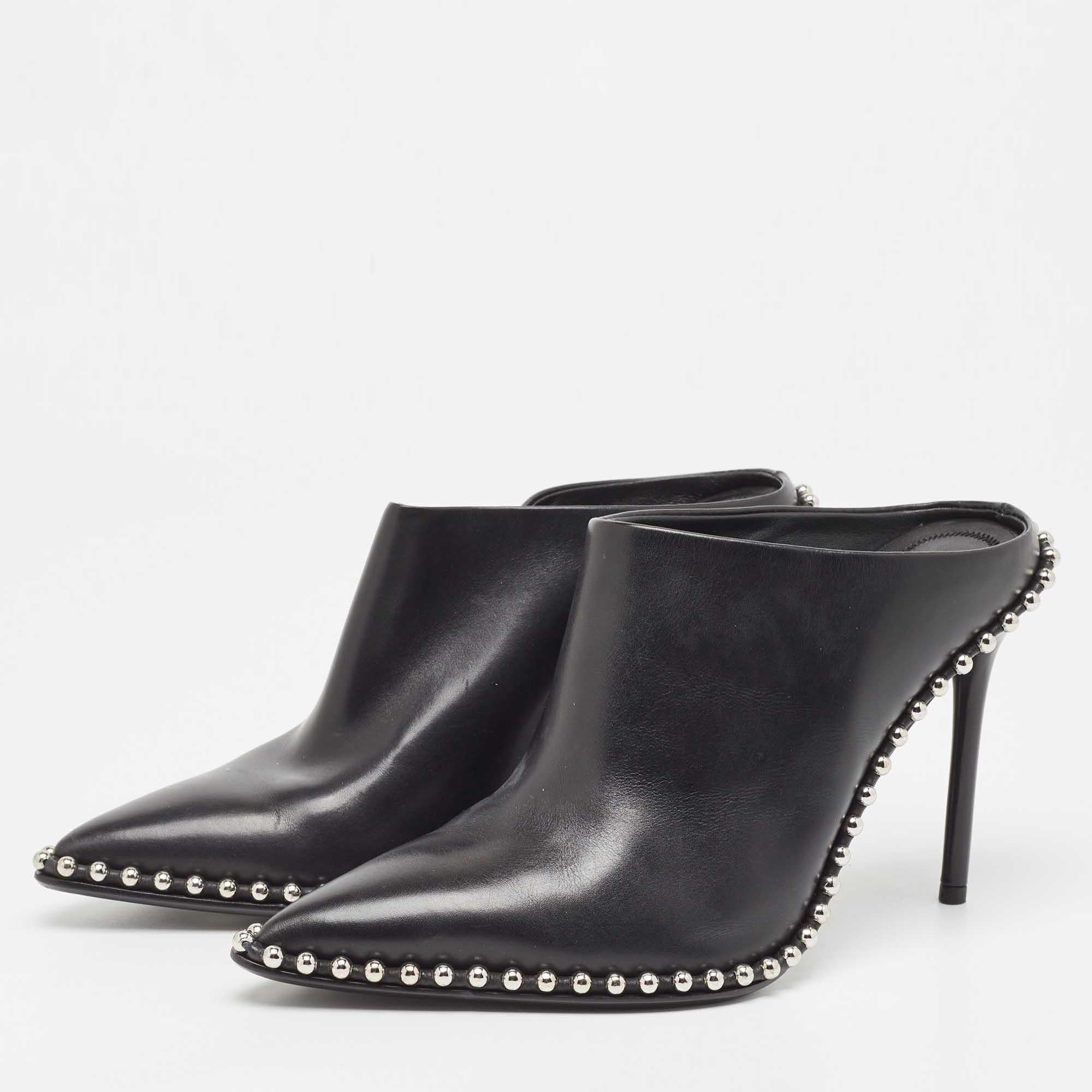 Alexander Wang's mules will lend a modern edge to your look. Crafted from leather into a pointed-toe silhouette, they feature a black shade, studs, and a backless design. These mules are elevated on 10.5 cm heels that provide the right amount of