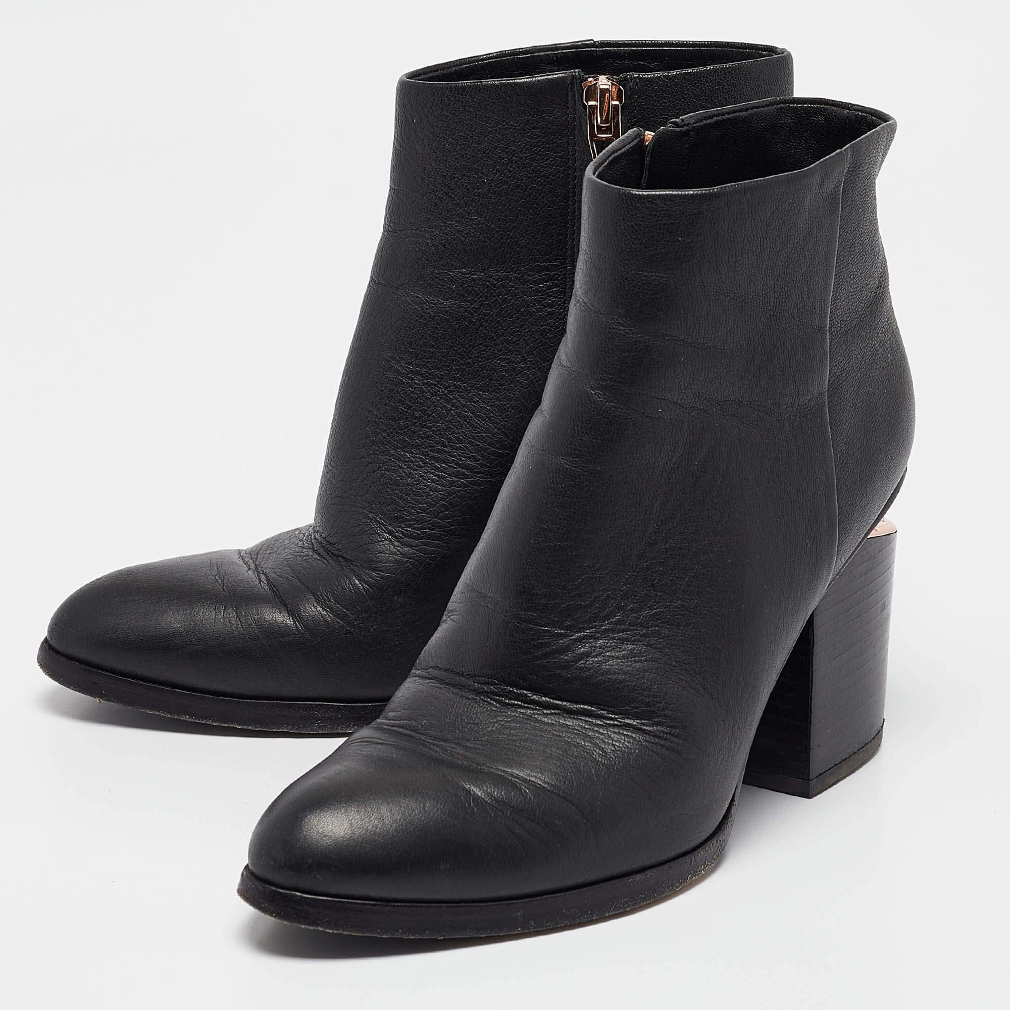 Youll find these Alexander Wang black leather ankle boots a reliable style companion. The classic shape  clean details  and block heels make them perfect for fall and beyond.
