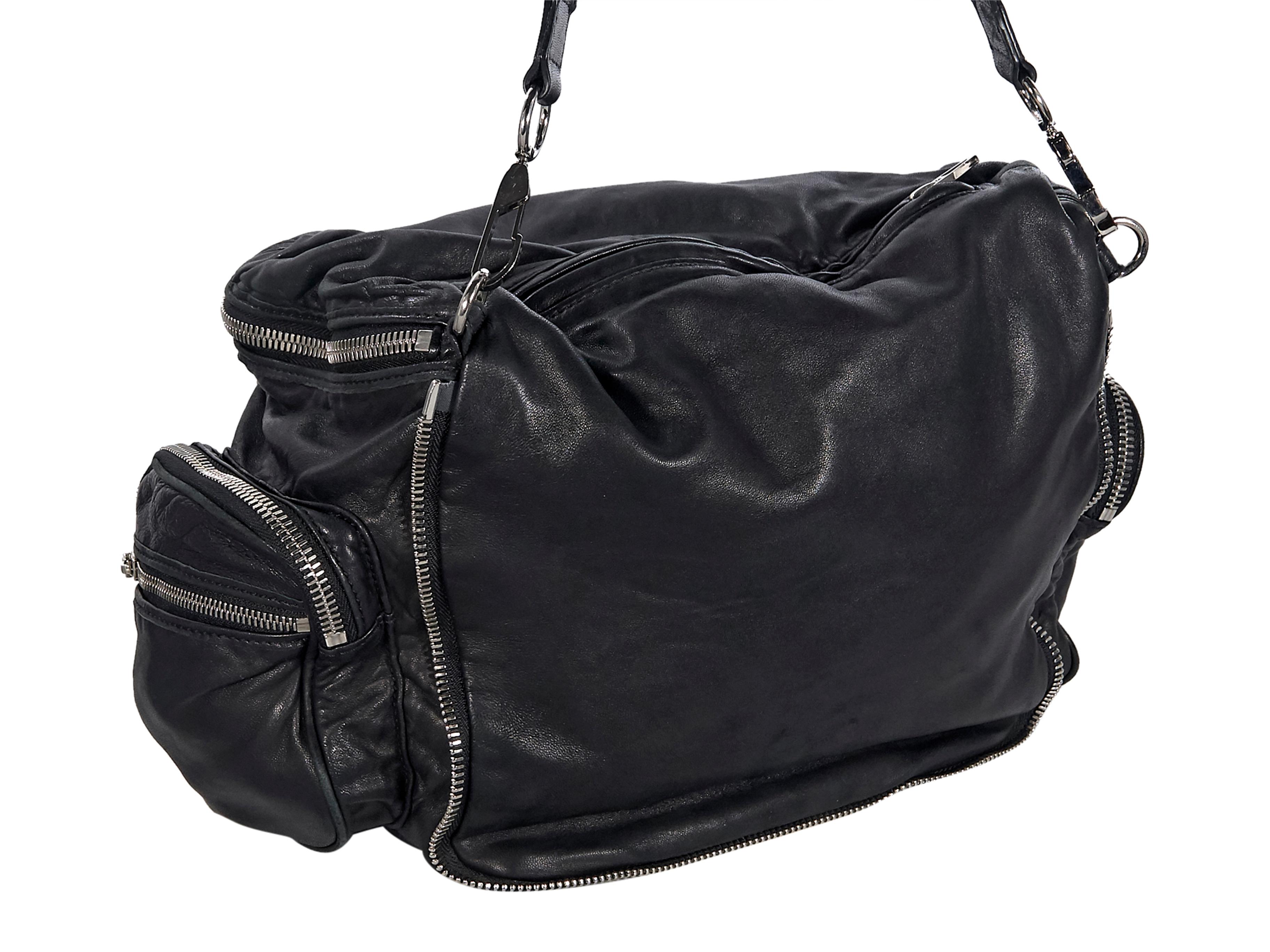 Product details:  Black leather Jane shoulder bag by Alexander Wang.  Trimmed with zipper placket.  Single shoulder strap.  Top zip closure.  Lined interior with inner zip pocket.  Exterior side zip pockets.  Silvertone hardware.  15