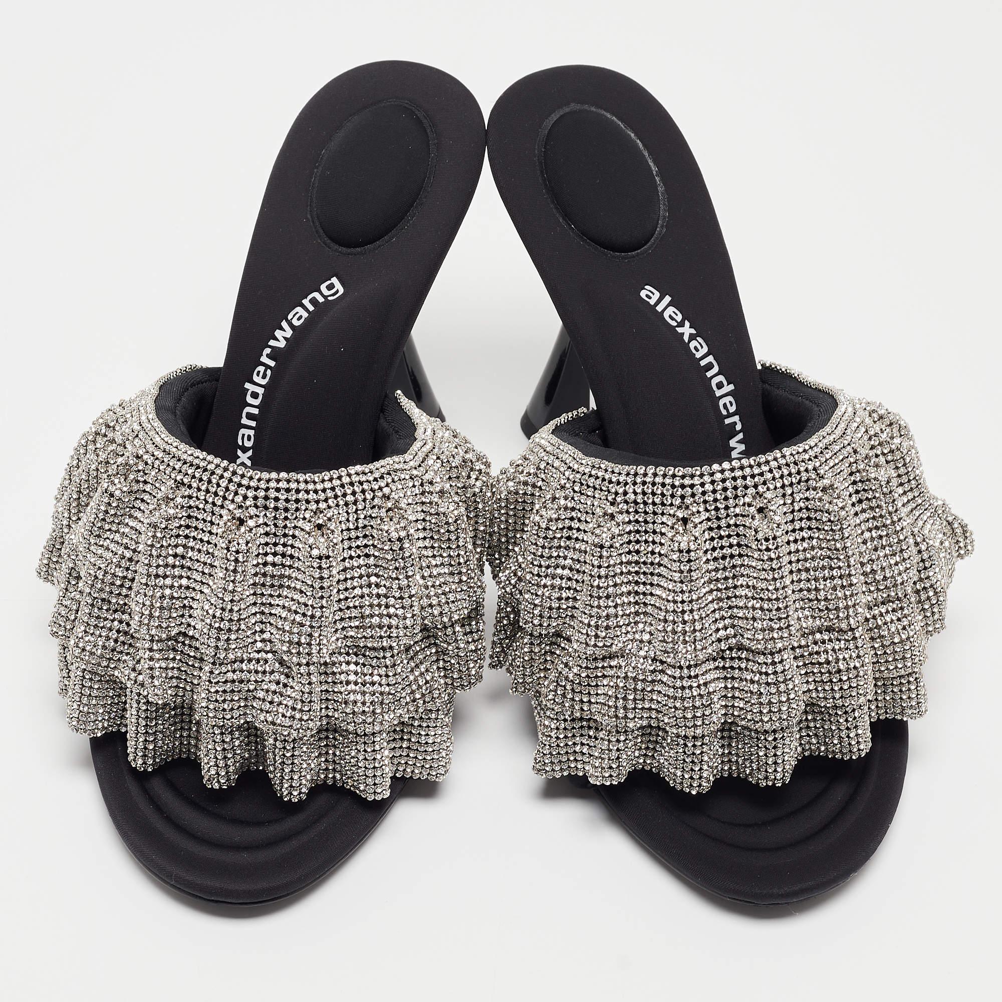 Deliver statement looks with these mules from Alexander Wang! From their shape and detailing to their overall appeal, they exude elegance.

Includes: Original Box, Extra Heel Tips, Extra Embellishments

