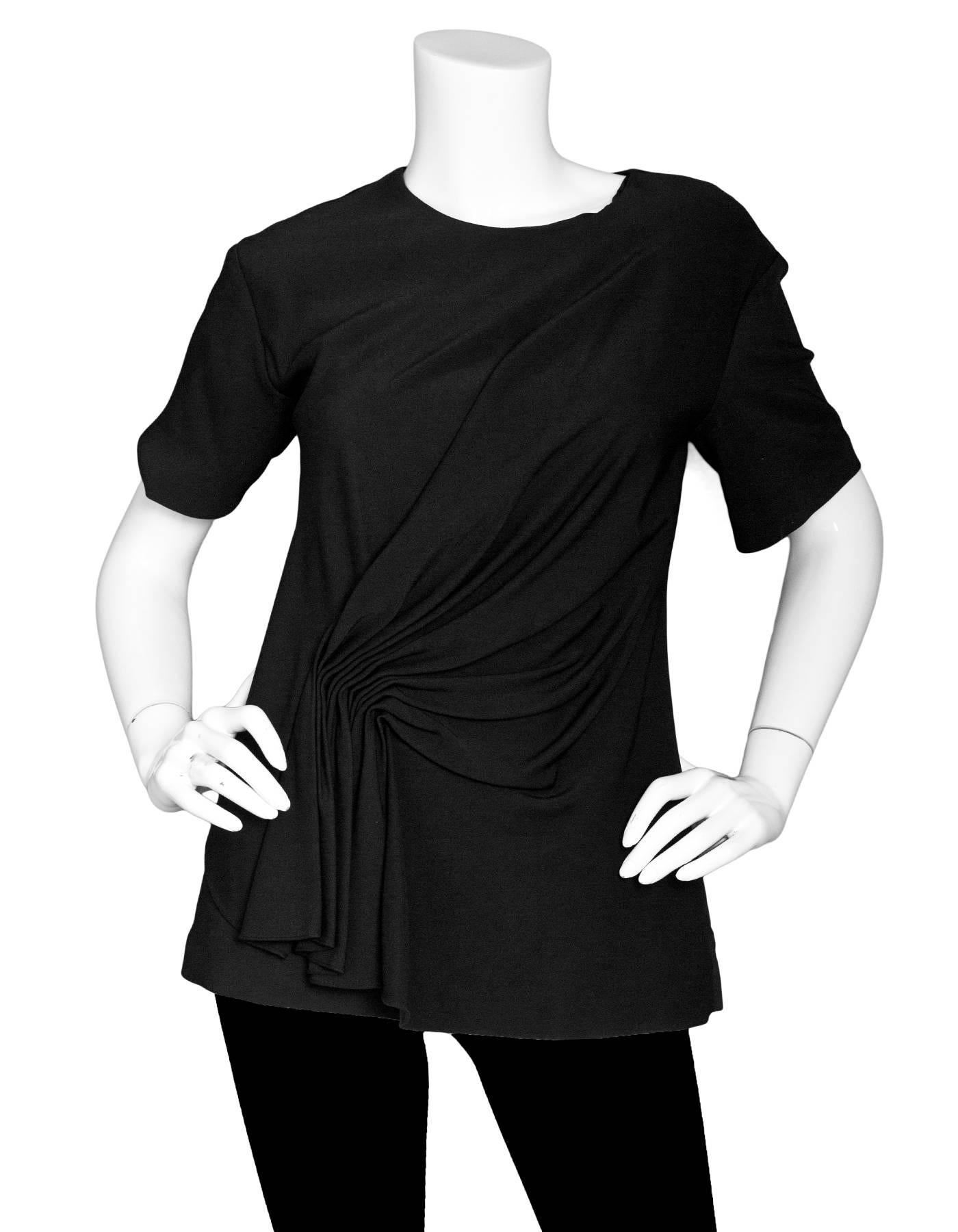 Alexander Wang Black Short Sleeve Top Sz 2

Made In: China
Color: Black
Composition: 97% viscose, 3% elastane
Lining: Black 85% polyester, 15% spandex
Closure/Opening: Back zip
Exterior Pockets: None
Interior Pockets: None
Overall Conditon: