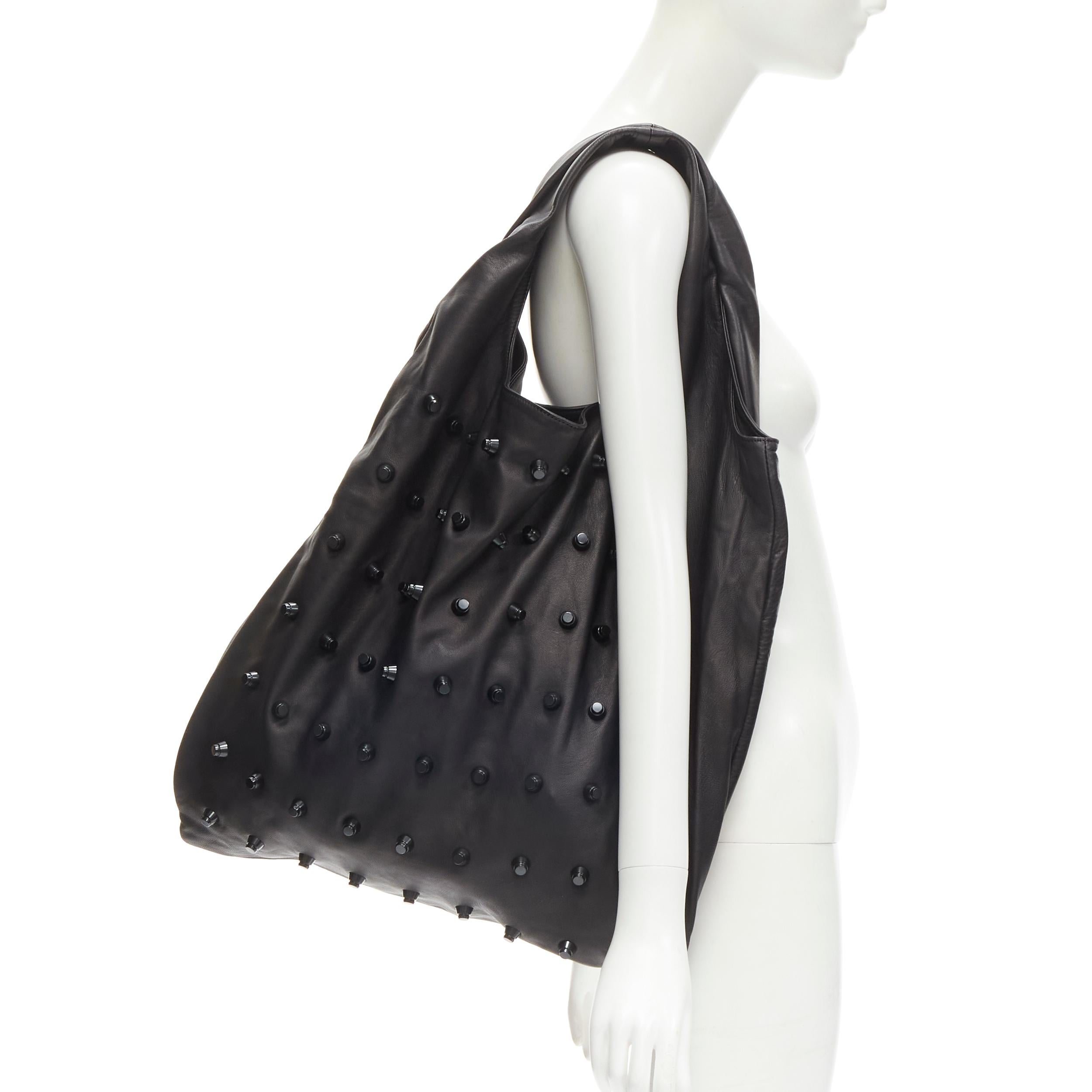 ALEXANDER WANG black soft leather punk studded tote bag
Brand: Alexander Wang
Designer: Alexander Wang
Material: Leather
Color: Black
Pattern: Solid
Extra Detail: Zip wall compartment.

CONDITION:
Condition: Very good, this item was pre-owned and is