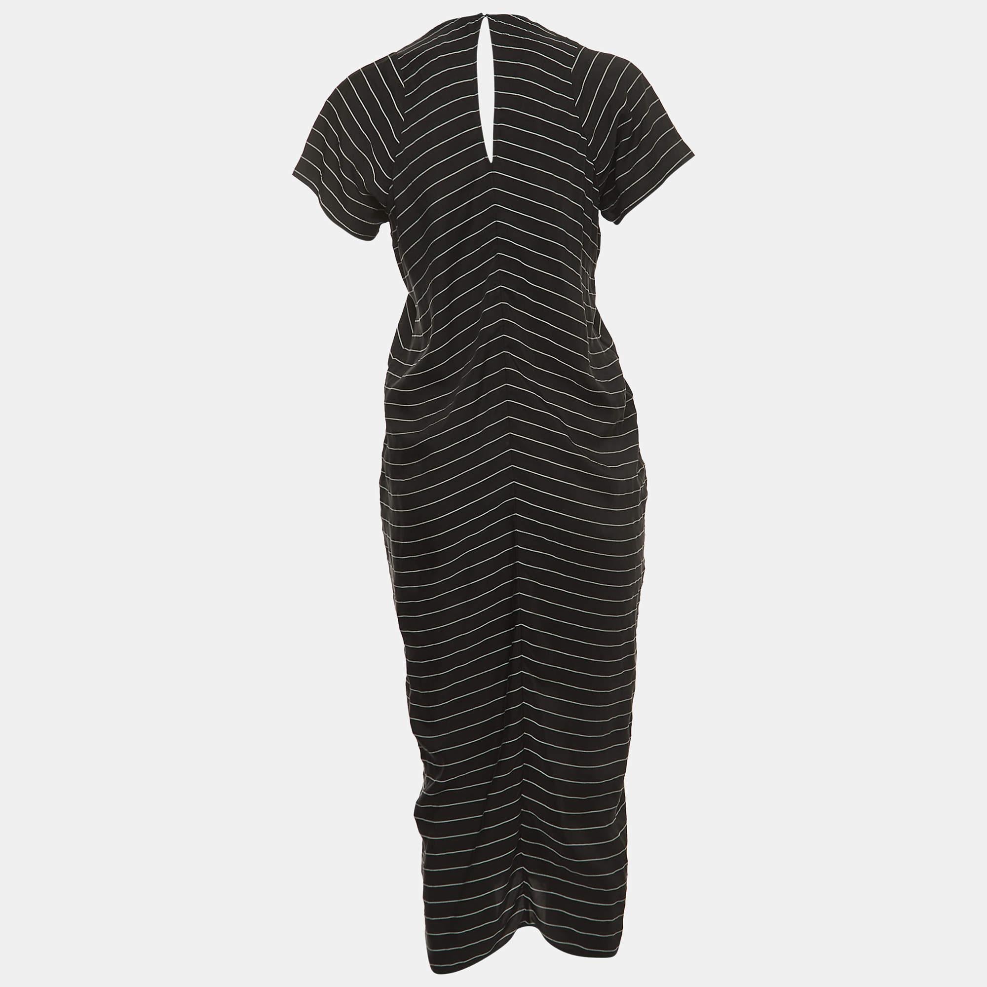 Step into timeless elegance with this Alexander Wang dress. Meticulously crafted, it embodies grace and sophistication, making it the perfect choice for those seeking an exquisite wardrobe addition.