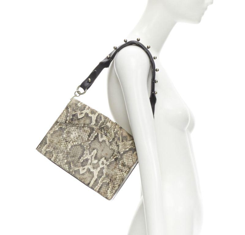 ALEXANDER WANG brown faux scaled leather black studded strap flap shoulder bag
Reference: ANWU/A00946
Brand: Alexander Wang
Designer: Alexander Wang
Material: Leather
Color: Beige, Black
Pattern: Animal Print
Closure: Magnet
Lining: Fabric
Extra