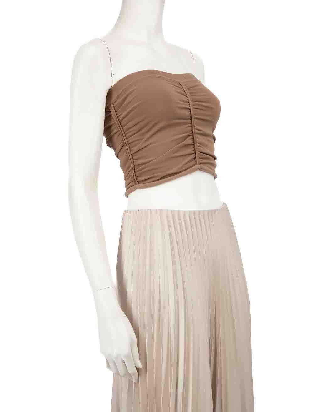CONDITION is Very good. Hardly any visible wear to top is evident. However, one side of the brand label is unstitched on this used Alexander Wang designer resale item.
 
 
 
 Details
 
 
 Brown
 
 Synthetic
 
 Tube top
 
 Sleeveless and strapless
 
