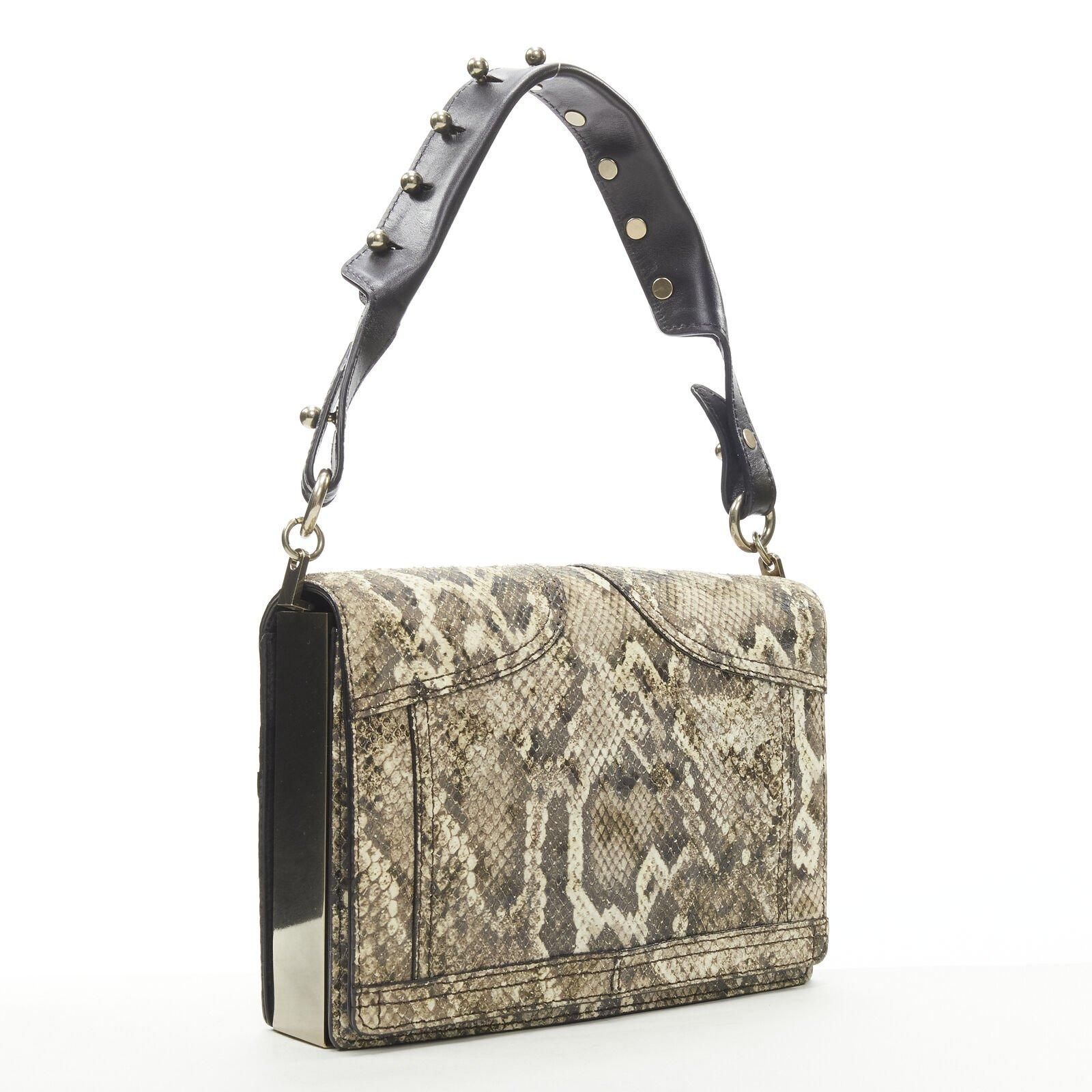ALEXANDER WANG brown scaled leather black studded strap flap shoulder bag
Reference: ANWU/A00946
Brand: Alexander Wang
Designer: Alexander Wang
Material: Leather
Color: Beige, Black
Pattern: Animal Print
Closure: Magnet
Lining:  Fabric
Extra