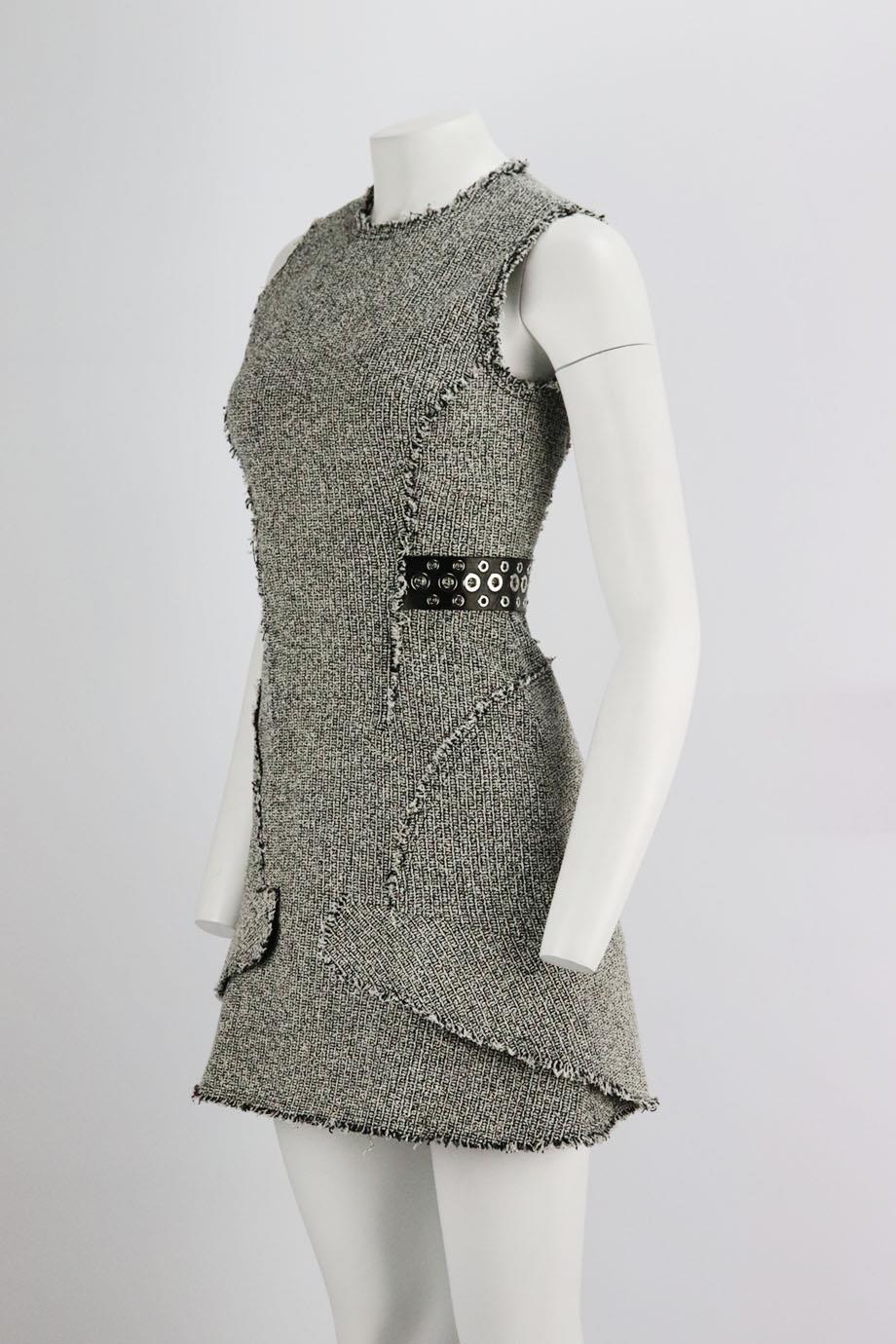 This mini dress by Alexander Wang is cut for a slim-fit from cotton-blend tweed, this mini dress finished with leather and silver-tone eyelet embellishment at the waist. Grey cotton-blend. Zip fastening at back. 70% Cotton, 11% viscose, 8% acrylic,