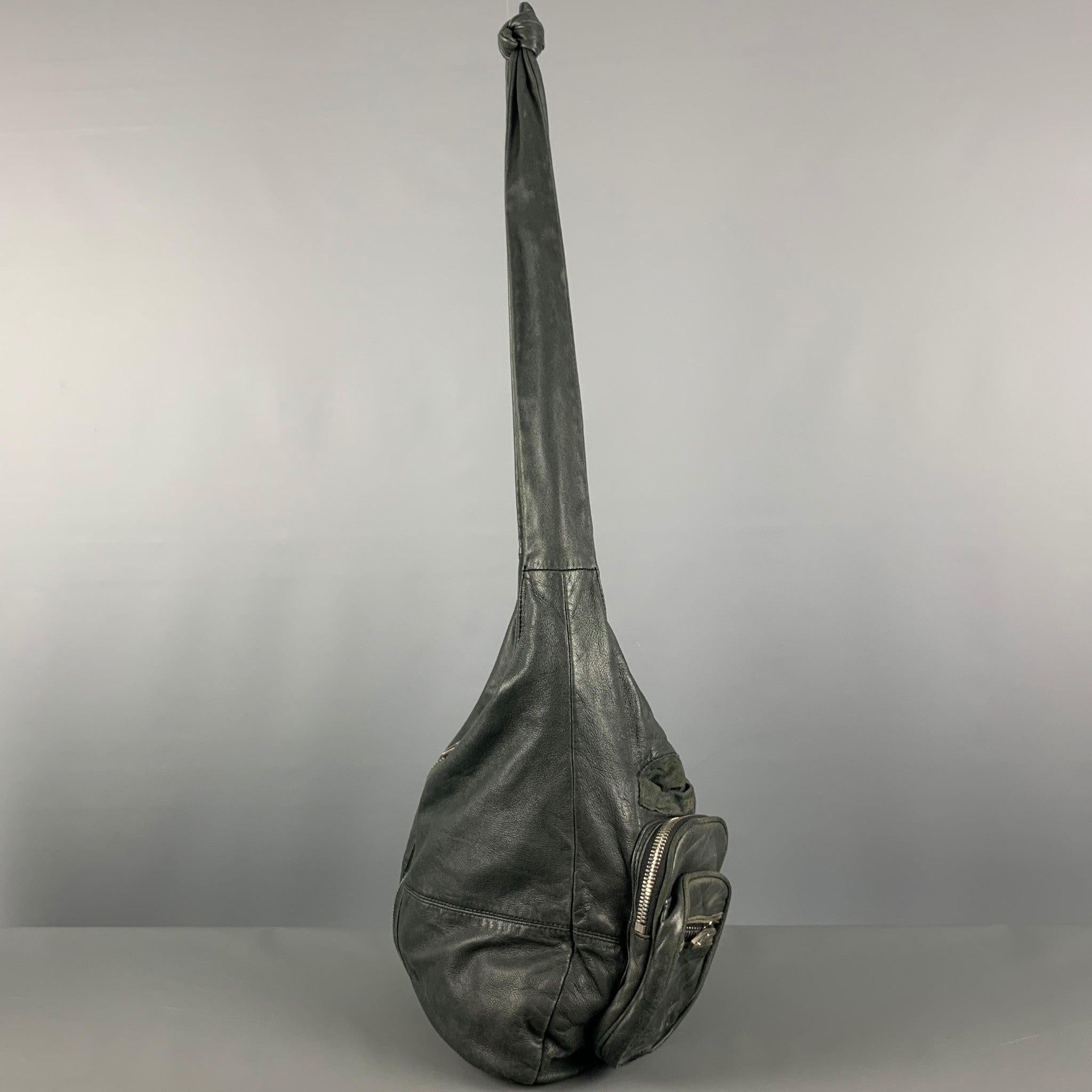 ALEXANDER WANG hobo handbag comes in a green leather featuring shoulder leather straps, silver tone hardware, donna pockets with zipper closure, inner pockets, and a zipper closure.Good Pre-Owned Condition. Moderate Signs of Wear. Moderate