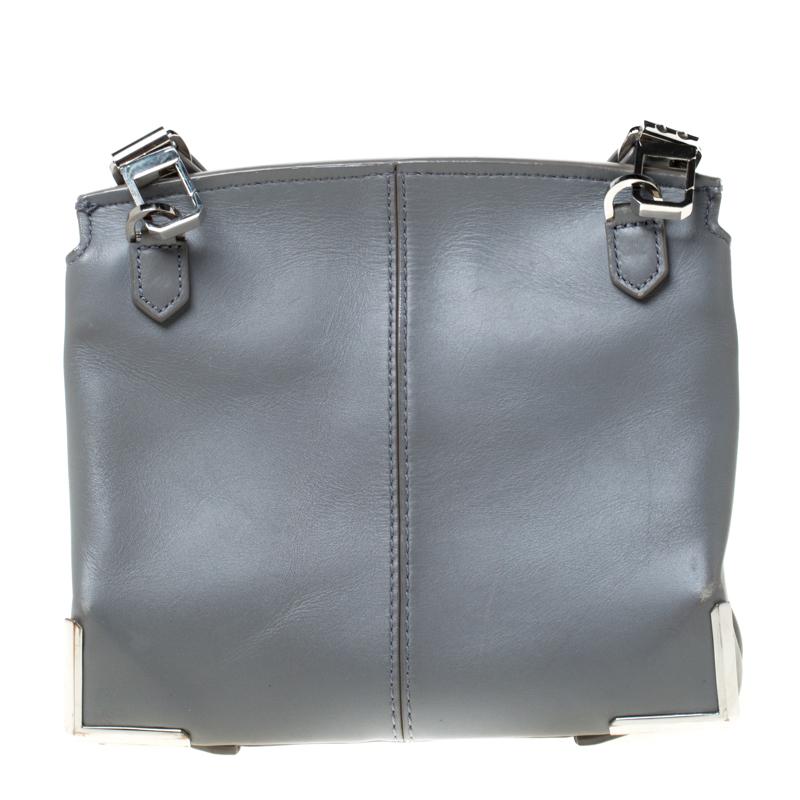 Covered in a lovely grey hue, this Alexander Wang bag is crafted from leather and shaped to impress. The flap secures a well-sized interior with a zip pocket and the bag is complete with a shoulder strap. Own this bag today and carry it with