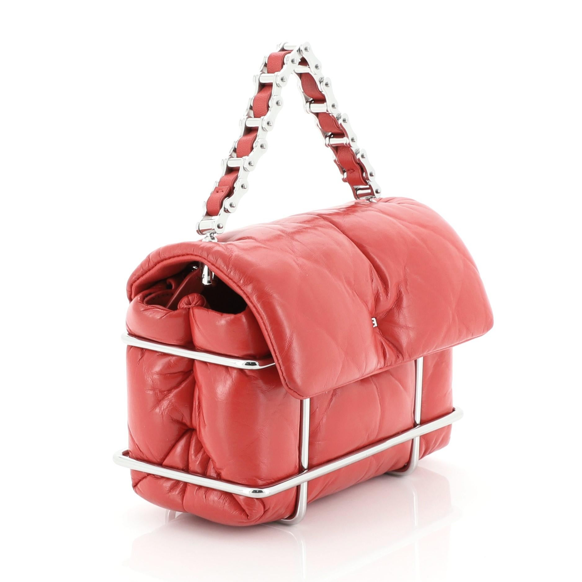 This Alexander Wang Halo Crossbody Quilted Leather, crafted from red leather, features a top handle, leather strap and silver tone hardware. Its closure opens to a black fabric interior zip pockets. 

Estimated Retail Price: $895
Condition: Great.