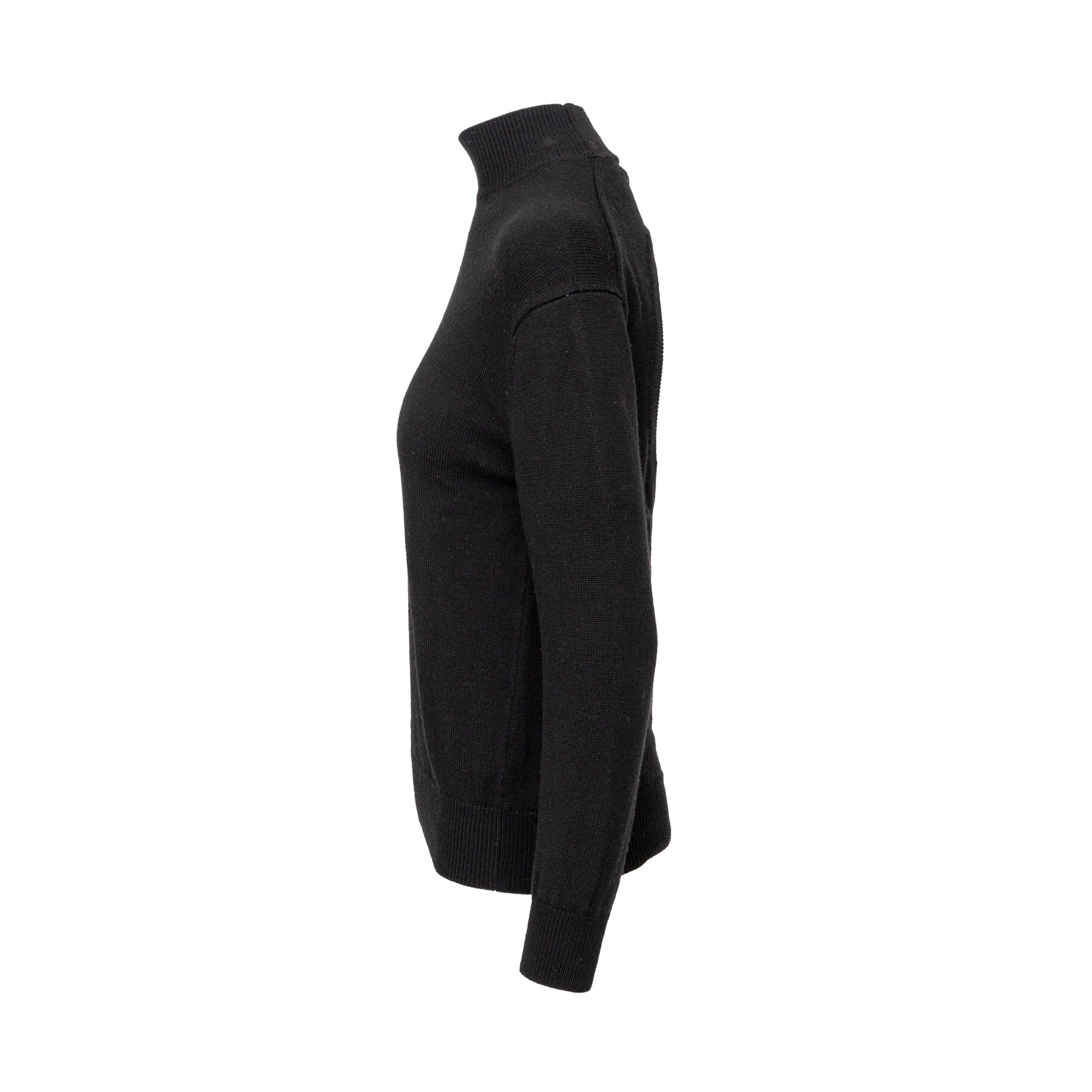 Ce pull à col montant Alexander Wang est le complément idéal de votre garde-robe. Confectionné en laine mérinos douce, il présente une découpe ronde unique dans le dos, qui ajoute une touche d'originalité au modèle noir classique à col montant. Avec