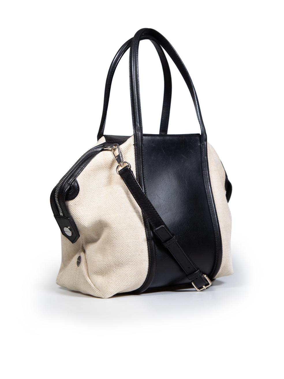 CONDITION is Very good. Minimal wear to bag is evident. Minimal scratches to the leather panel on the top, front and back. Minor discolouration to the bottom four corners. Glue mark found on internal right side of lining on this used Alexander Wang