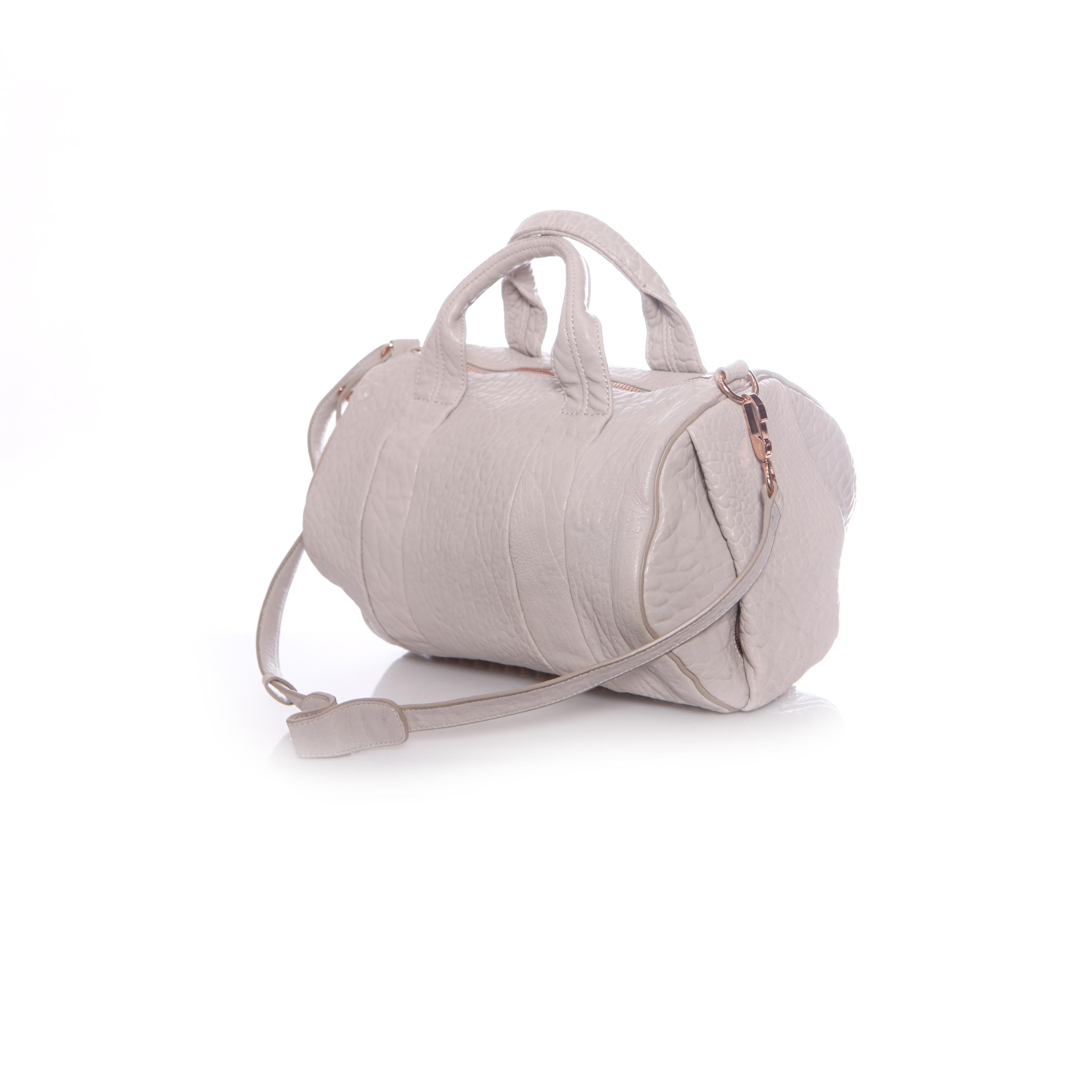 Gray Alexander Wang, light grey rockie bag with rose coloured studs. For Sale