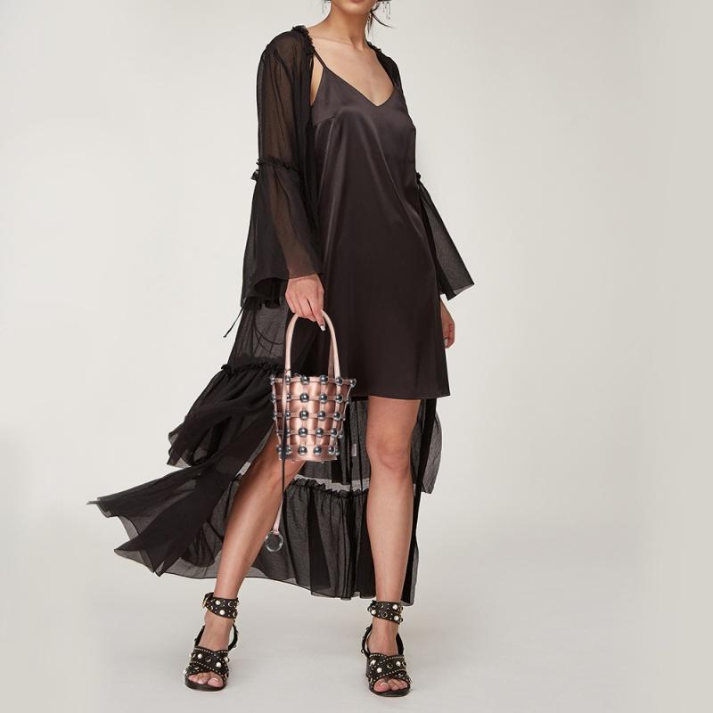 This stunning bucket bag by Alexander Wang is perfect for lunches and outings with friends. Crafted from luxurious satin, it carries a striking shade of metallic rose. It has stylish handles, a leather-lined interior and silver-tone studs.

