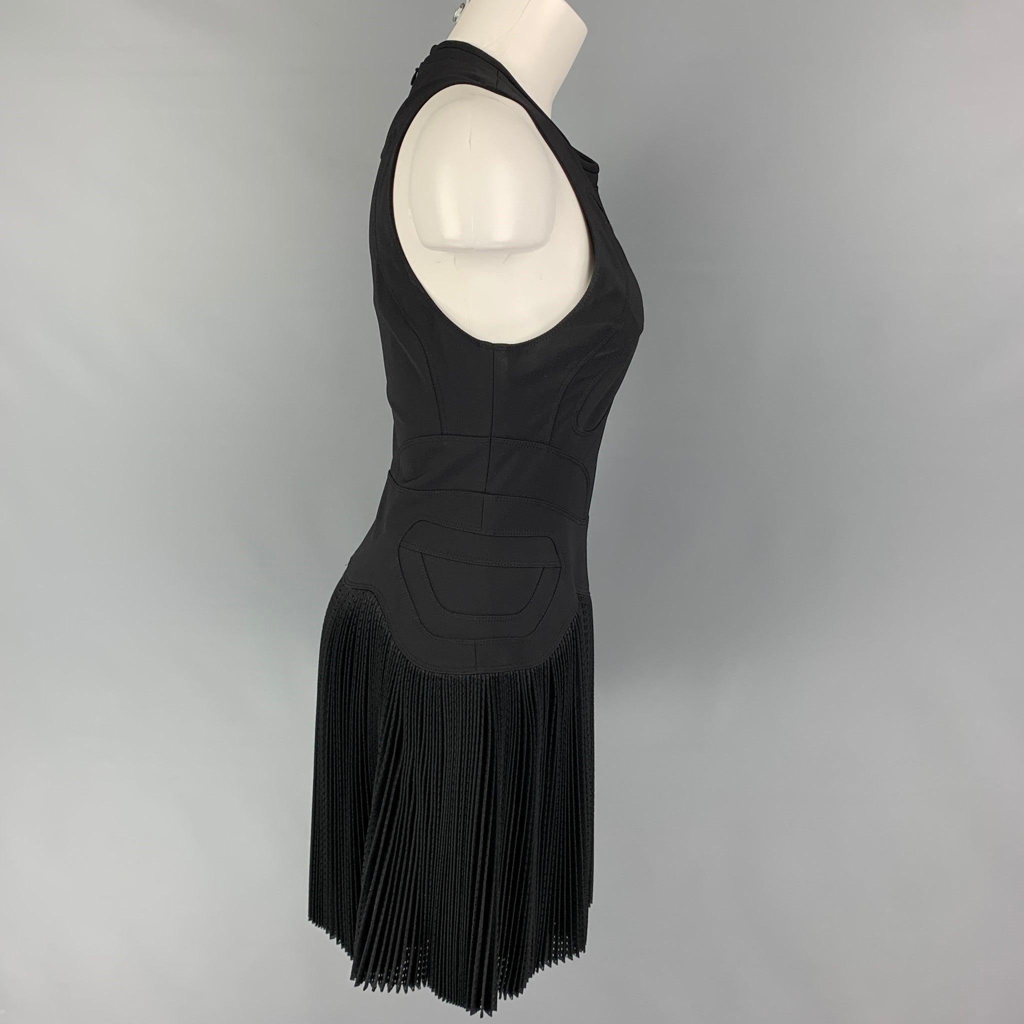 ALEXANDER WANG dress comes black polyamide featuring top stitching, sleeveless, pleated mesh skirt, and a back zip up closure. Good Pre-Owned Condition. Light discoloration at under arms. As-Is.  

Marked:   10  

Measurements: 
  Bust: 32 inches 