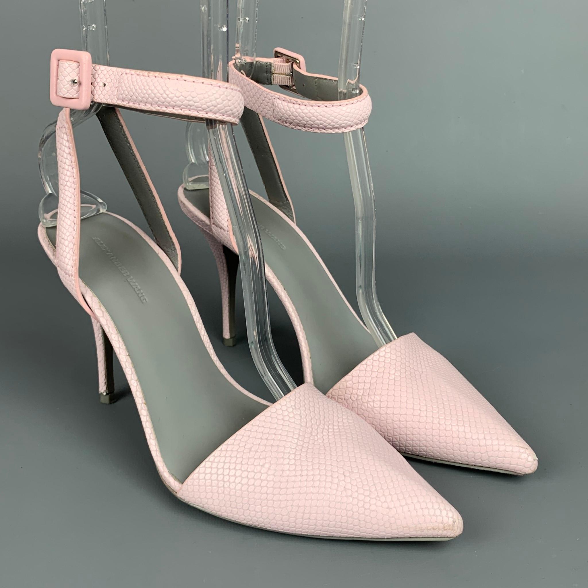 ALEXANDER WANG pumps comes in a lilac embossed leather featuring a pointed toe, ankle strap, wooden sole, and a stacked heel. 

Very Good Pre-Owned Condition. Moderate scruff at toe.
Marked: 38
Original Retail Price: $420.00

Measurements:

Heel: 4