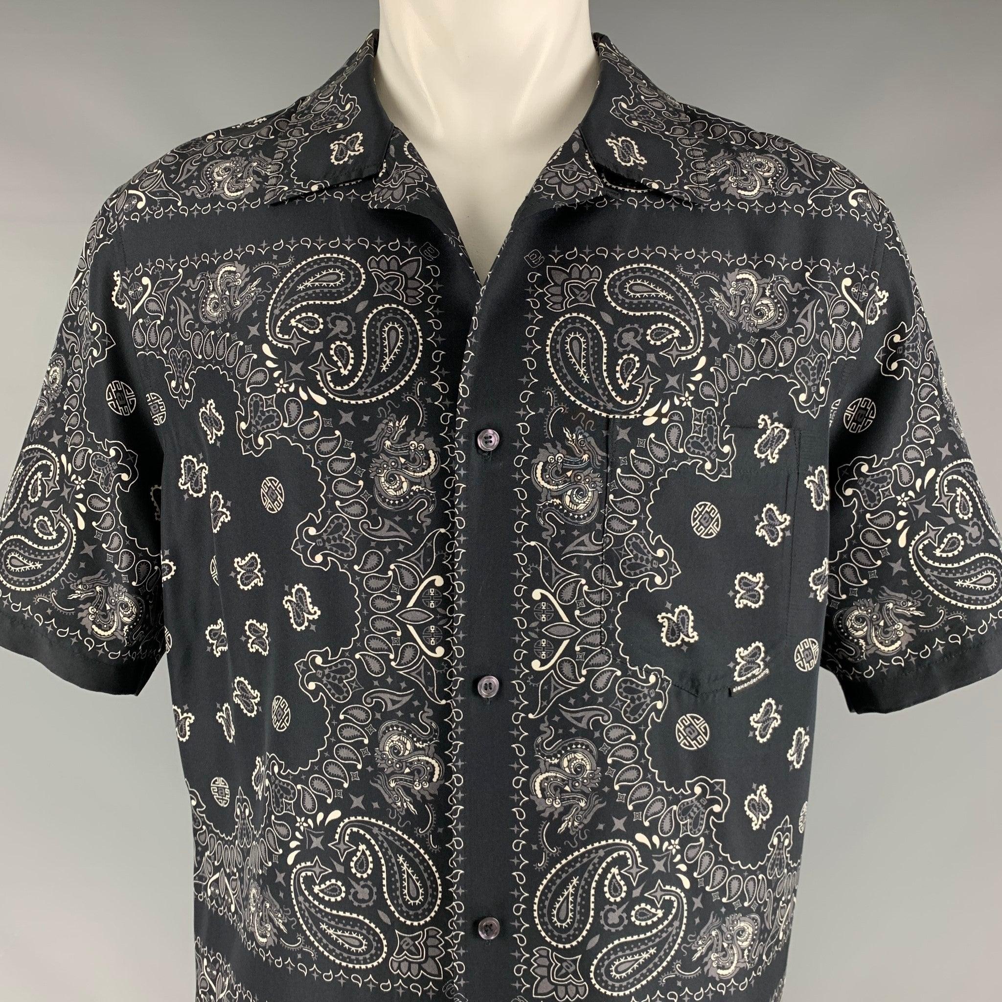 ALEXANDER WANG set
in a black and white silk fabric featuring a bandana style print, one pocket, and a button closure. Comes with matching shorts.Very Good Pre-Owned Condition. Minor signs of wear. 

Marked:   M 

Measurements: 
  - ShirtShoulder: