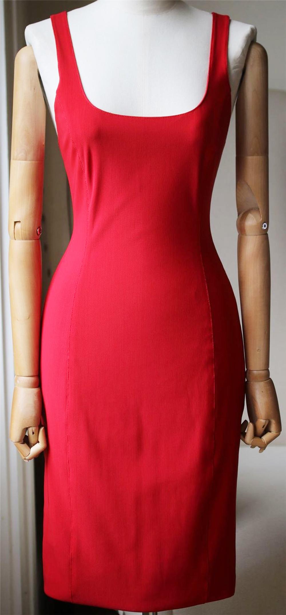 This stretch-knit dress has a sporty racer-back and is punctuated with the label's signature industrial zip all the way through the back. Red stretch-knit. Two-way zip fastening through back. 80% Nylon, 20% elastane. 

Size: US 0 (UK 4, FR 32, IT
