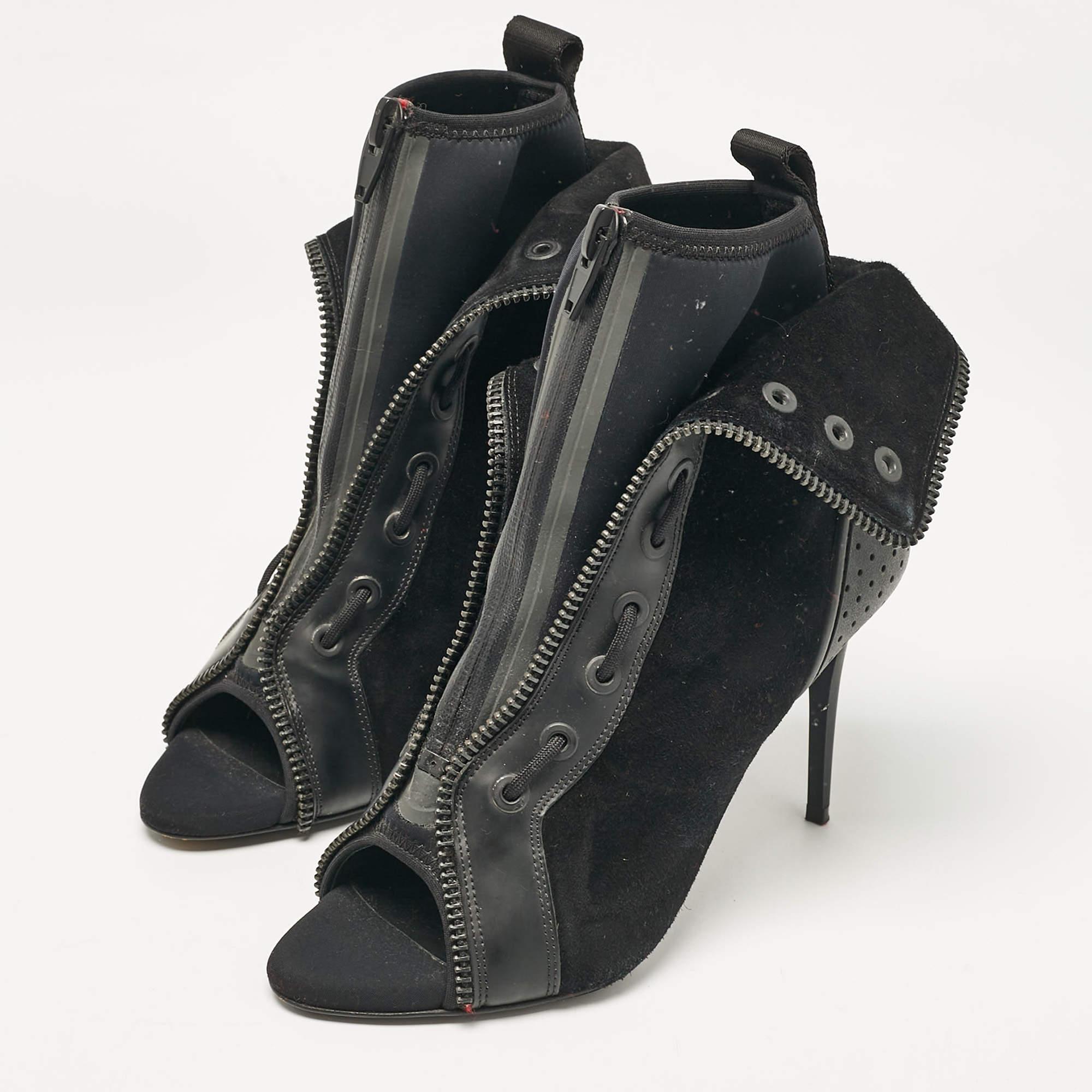 Youll find these Alexander Wang x H and M black leather ankle boots a reliable style companion. The classic shape  clean details  and block heels make them perfect for fall and beyond.