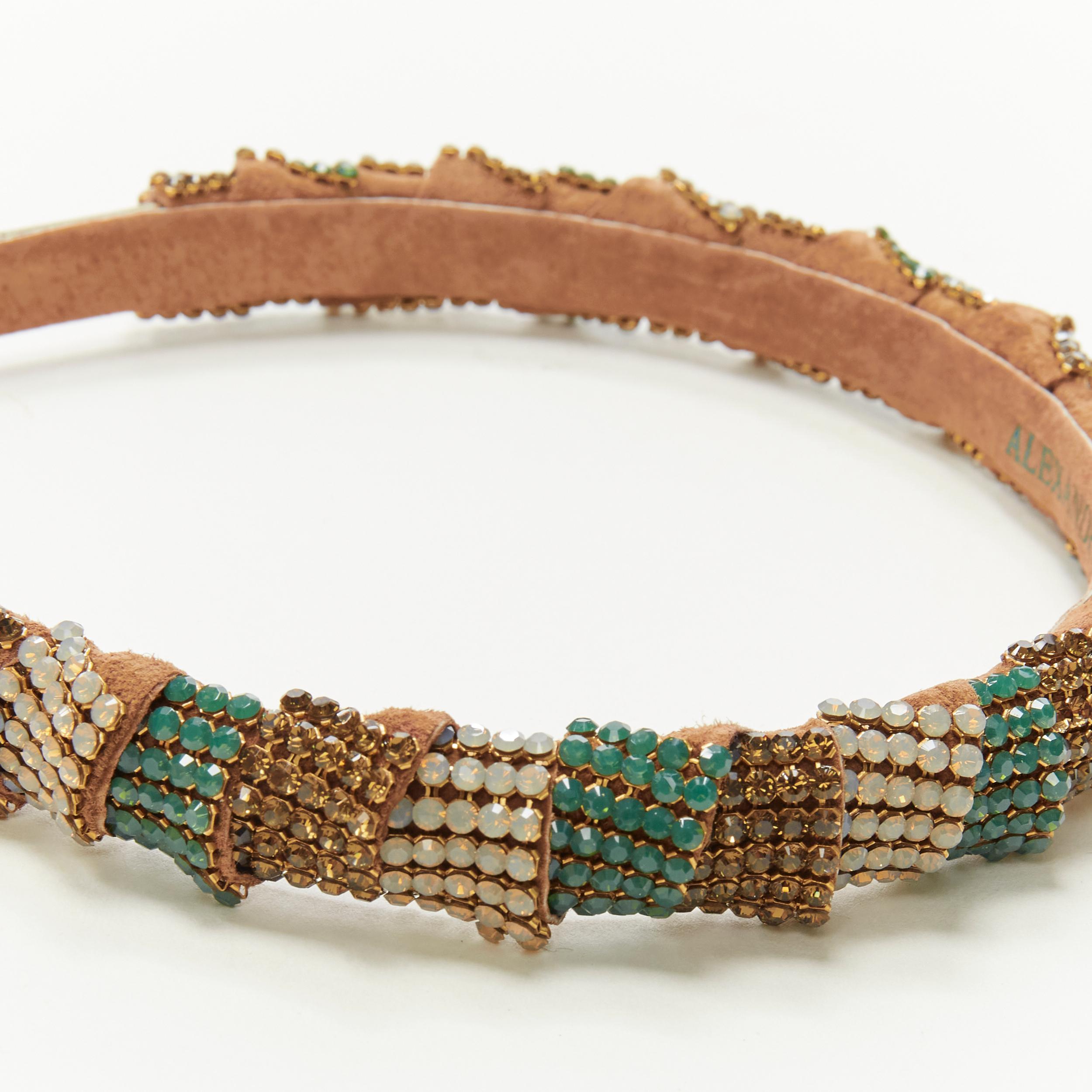 ALEXANDER ZOUARI bronze leather copper white green crystal encrusted headband 
Reference: ANWU/A00206 
Brand: Alexandre Zouari 
Designer: Alexandre Zouari 
Material: Suede 
Color: Brown 
Pattern: Solid 
Made in: France 

CONDITION: 
Condition: