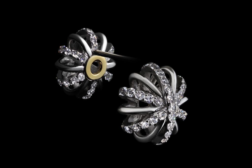 A pair of 10mm 18 Karat white gold and Diamond snowflake stud earrings with Alexandra Mor signature details of 1mm melee bands and knife-edged wire.  Limited edition of 25. Signed by artist. Crafted in the USA.

Unisex  Engagement  Men  Women 