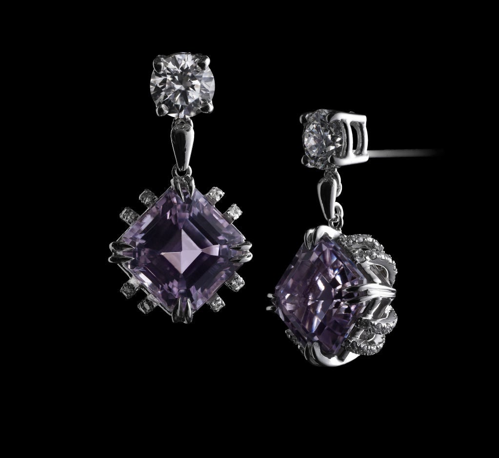 *Please contact us for more information on this piece or on creating your own Alexandra Mor custom Design. 

A pair of Alexandra Mor earrings featuring Asscher-cut Kunzite weighing 4.70 carats which is suspended from a 0.42 carat round diamond.