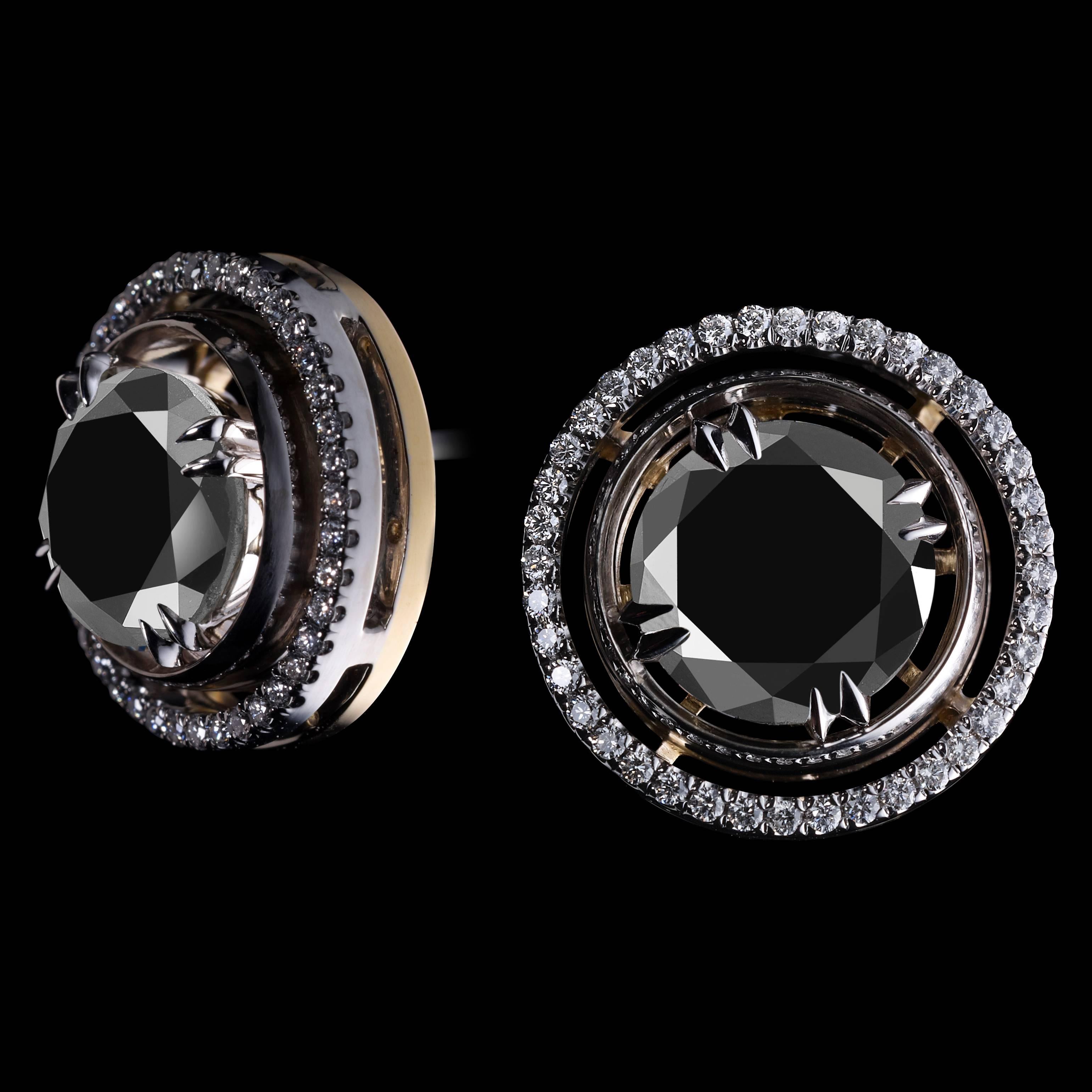 A pair of Round Black Diamond Cuff Links featuring Round Black Diamond Centers weighing 4.34 carats total detailed with 78 1mm signature floating Diamond melee and knife-edged wire. Cuff Links measure 1/2 inch in diameter and are set in Platinum