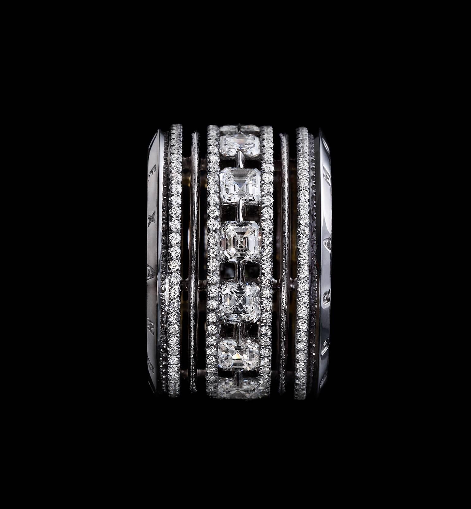 An Alexandra Mor  wide eternity platinum diamond band comprised of 14 Asscher-cut Diamonds and Ideal-cut diamond melle , G VS quality,  detailed with Alexandra Mor’s signature 1mm melee bands, knife-edged wires and engraved  on beveled edges. 