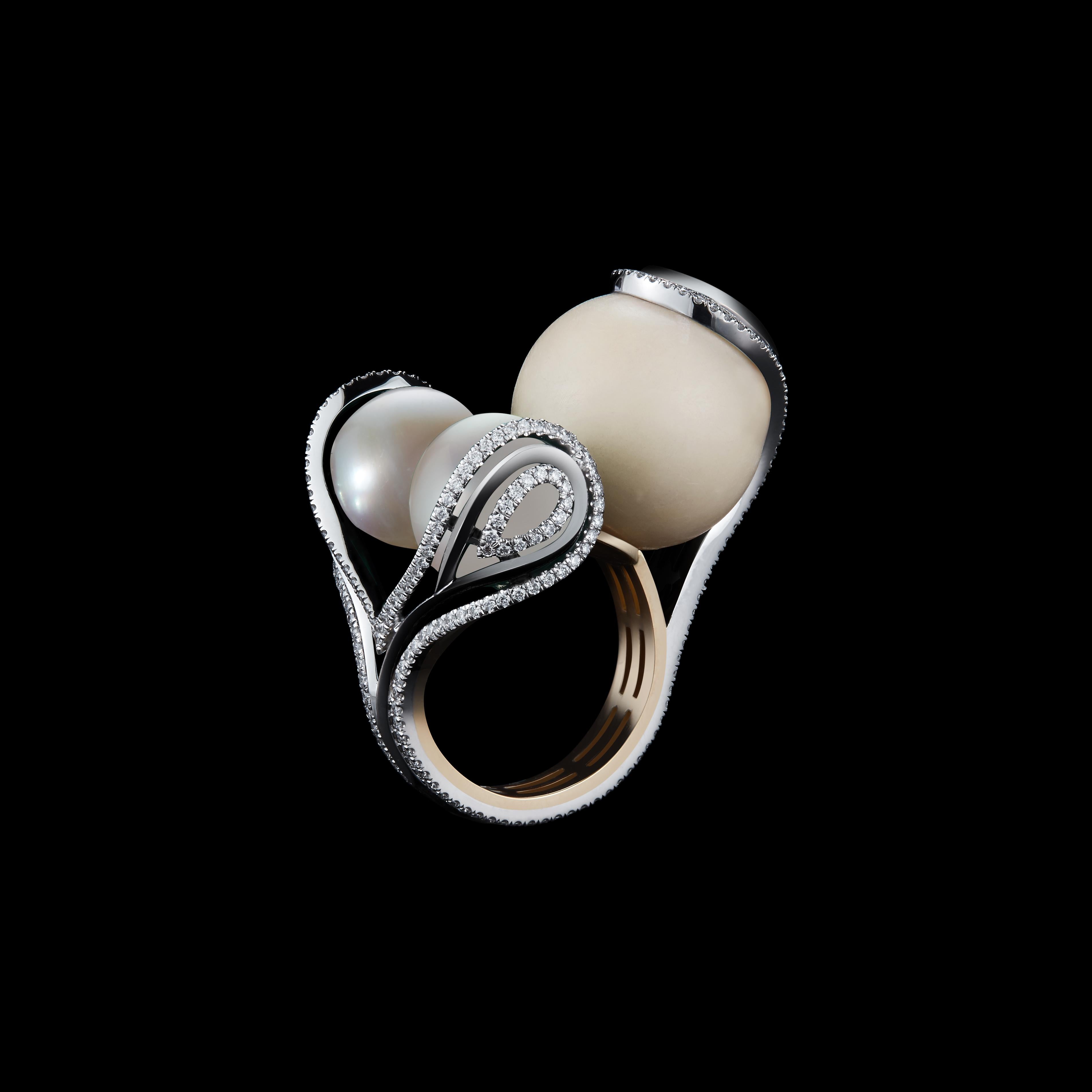 An Alexandra Mor One-Of-a-Kind Sphere Ring set with a pair of south sea pearls measuring 15 mm,  16.80 carat wild Tagua- Seed Bead. Platinum set on 18KY Gold Alexandra Mor logo gallery with Alexandra Mor's signature Feather design of 1mm kinfe-edged