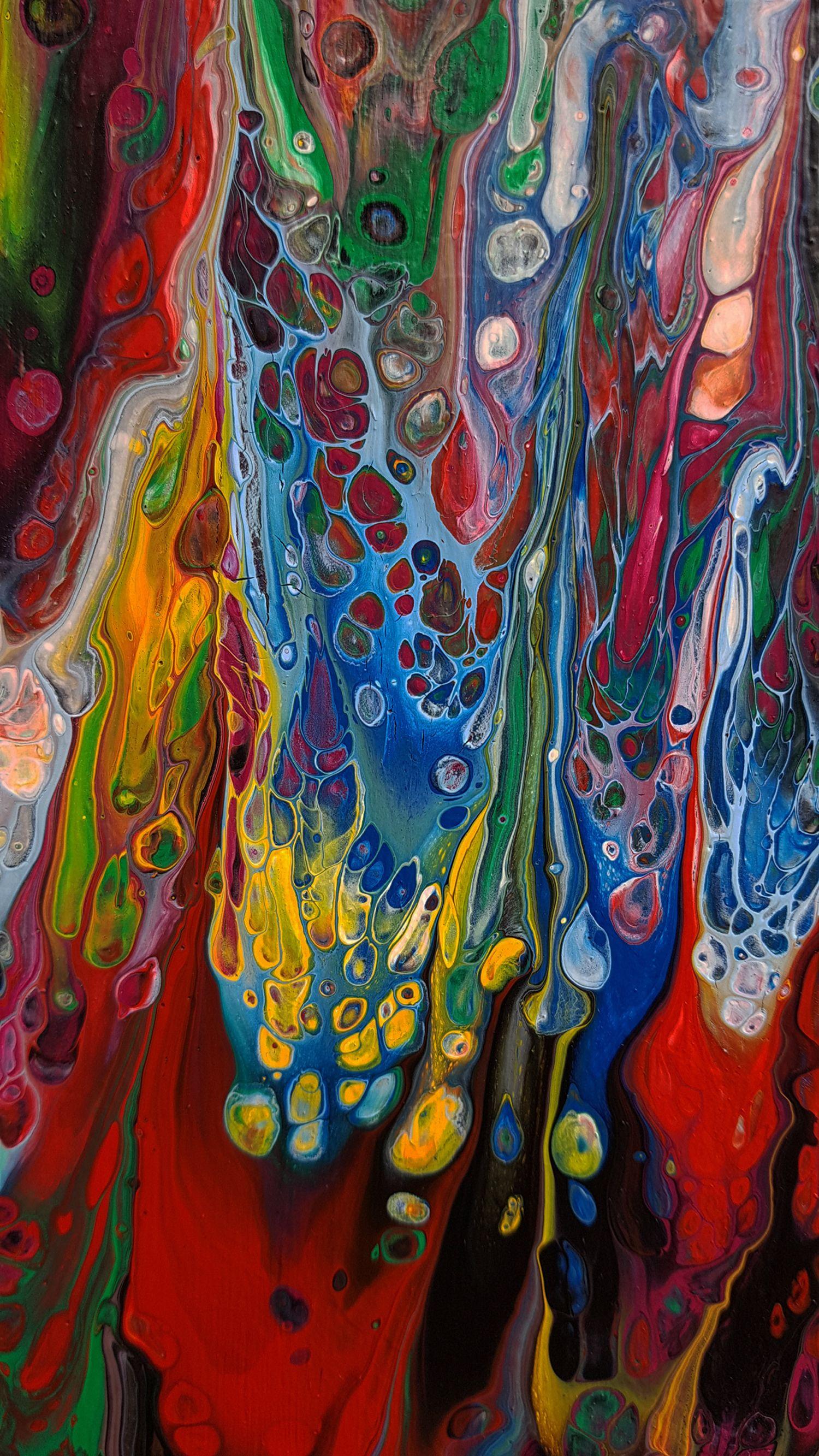 It is an extra-large abstract painting with exciting colours that expressively play off of each other in this one-of-a-kind statement piece with unique textures and fierce movement; vivid red, yellow, orange, green, blue, black, white, violet, and