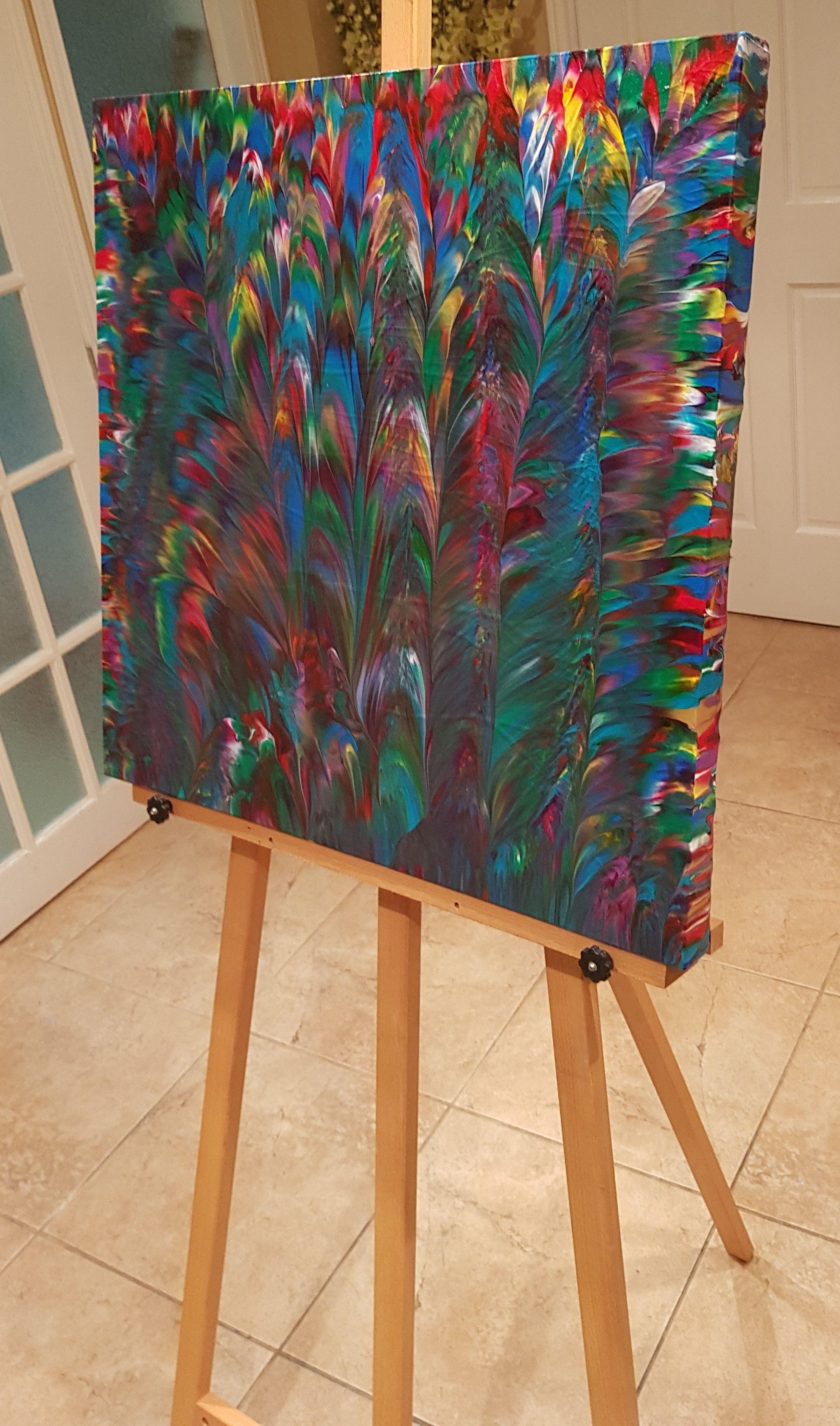 Tropical Paradise is an original abstract expressionism painting created with a dark emerald green hue with complimentary red, purple, and yellow accents that help add warmth. A beautiful cerulean blue hue adds freshness to a piece that was painted