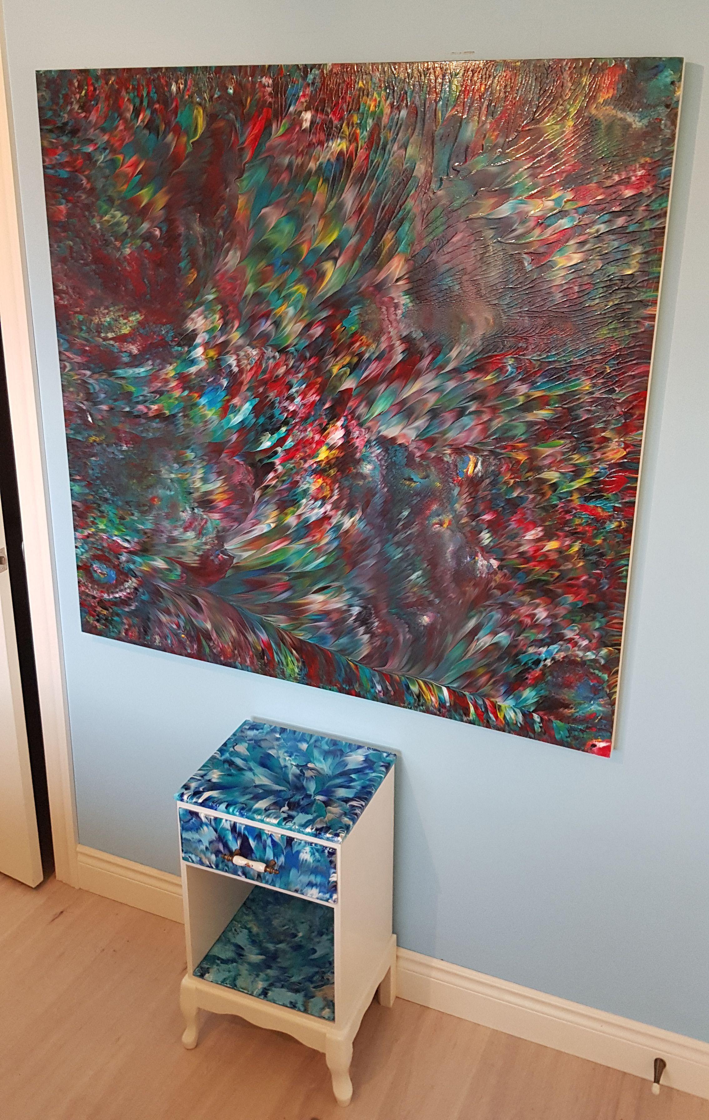 It is a large statement piece with vivid colors that catch the attention of anyone in the room; the lights in the room bounce off of the high-gloss finish and make the high-quality acrylic paints appear wet. Colors such as dark greens, teals,