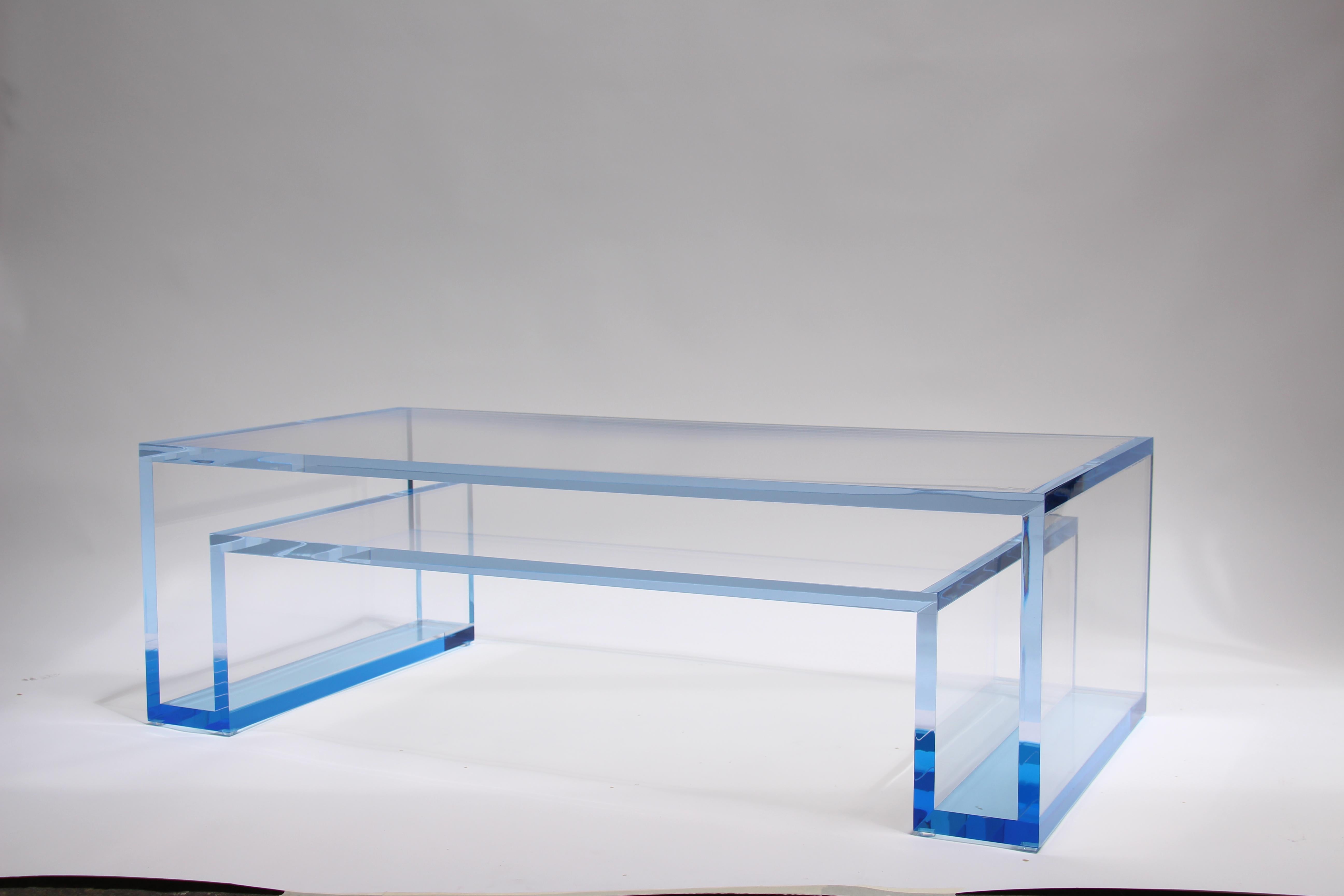 The Alexandra Von Furstenberg Brilliant Rectangle Coffee Table in Lagoon and Clear Acrylic draws inspiration from our iconic and best-selling Brilliant Console. With its clean lines, this lucite coffee table offers a minimalist yet impactful design