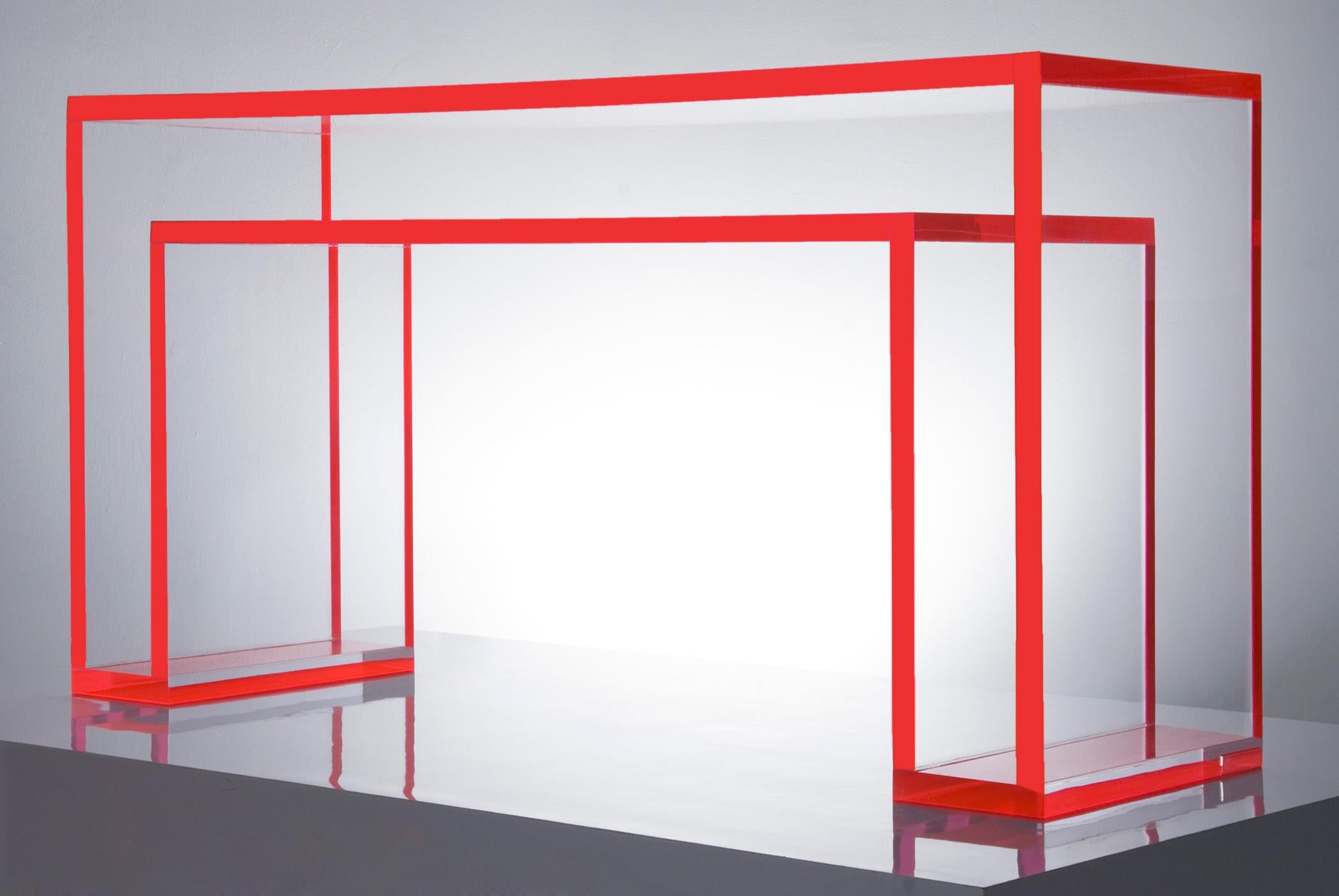 The Alexandra Von Furstenberg Brilliant Console in red and clear lucite features sleek, sophisticated lines that add the perfect touch of color to any room in your home or office. An Iconic piece from Alexandra Von Furstenberg's contemporary