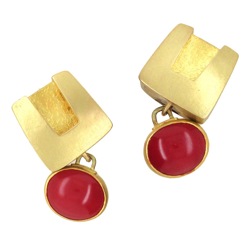 22K and 18K yellow gold earrings by Alexandra Watkins of the studio Janiye, set with two oval oxblood coral cabochons.  The earrings, with posts and omega backs, measure 5/8