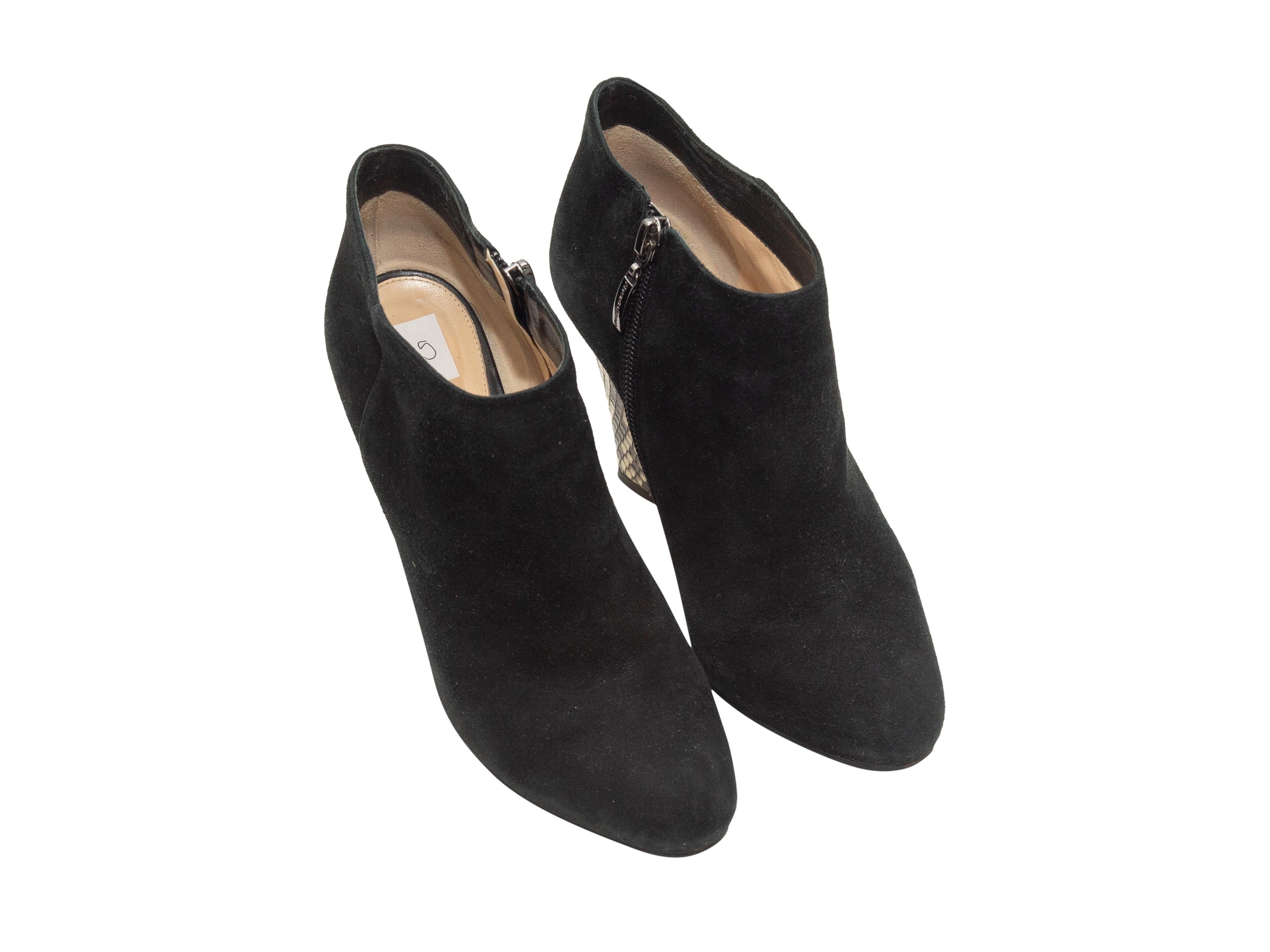 Product details: Black suede and snakeskin booties by Alexandre Birman. Zip closures at inner sides. 3.5