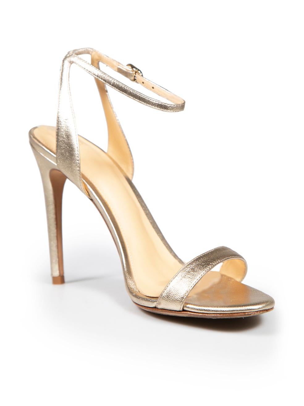 CONDITION is Good. General wear to shoes is evident. Moderate signs of wear to both shoe heels with marks and abrasions to the leather on this used Alexandre Birman designer resale item.
 
 Details
 Gold
 Leather
 Heels
 Open toe
 High heeled
