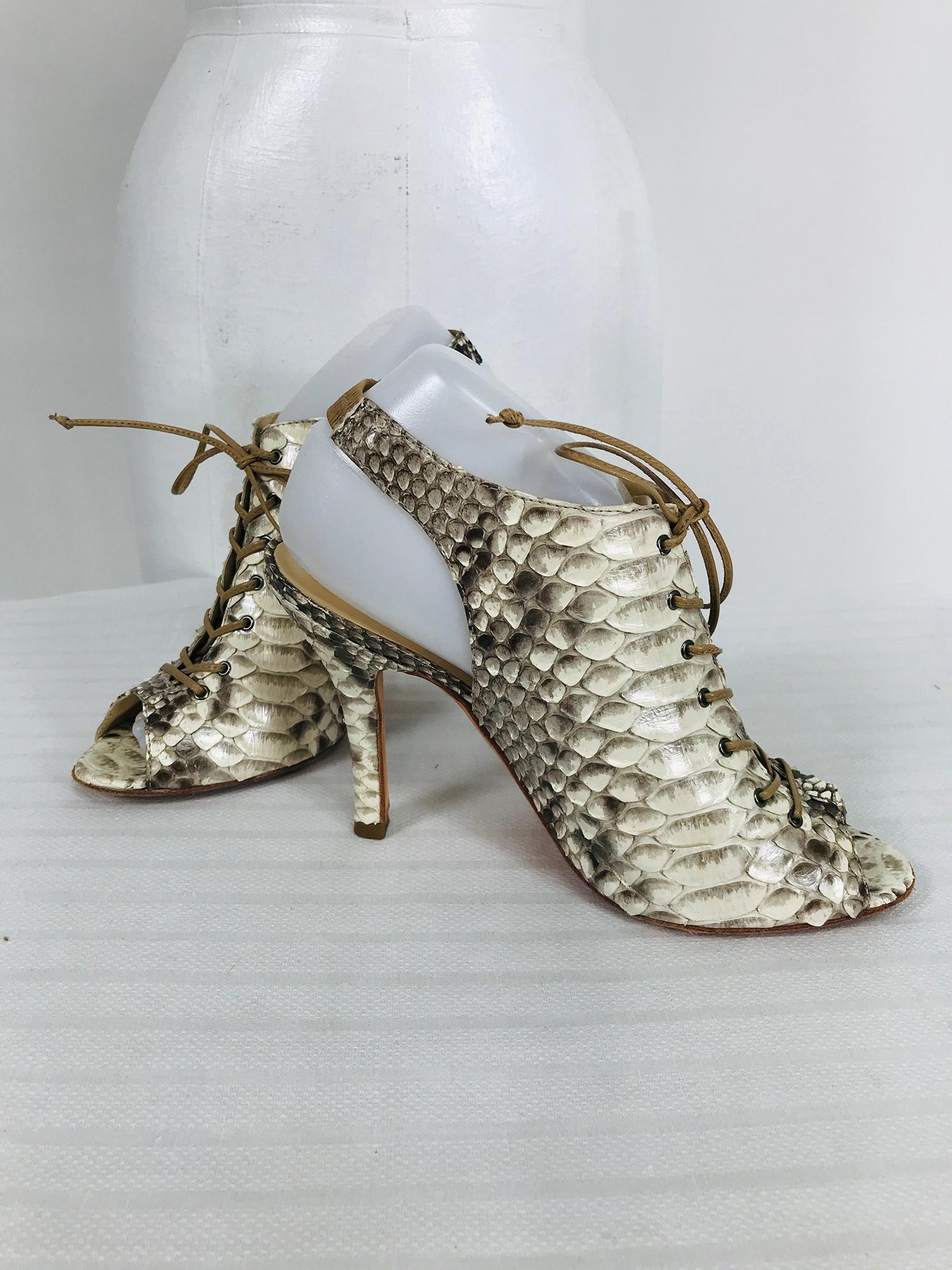 Alexandre Birman, snake skin, laced front, open toe, sling back, high heels marked size 9B. Fabulous shoes in very good, barely worn condition. Leather laces close at the front, open peep toes and cased elastic sling back heels. High skinny 4