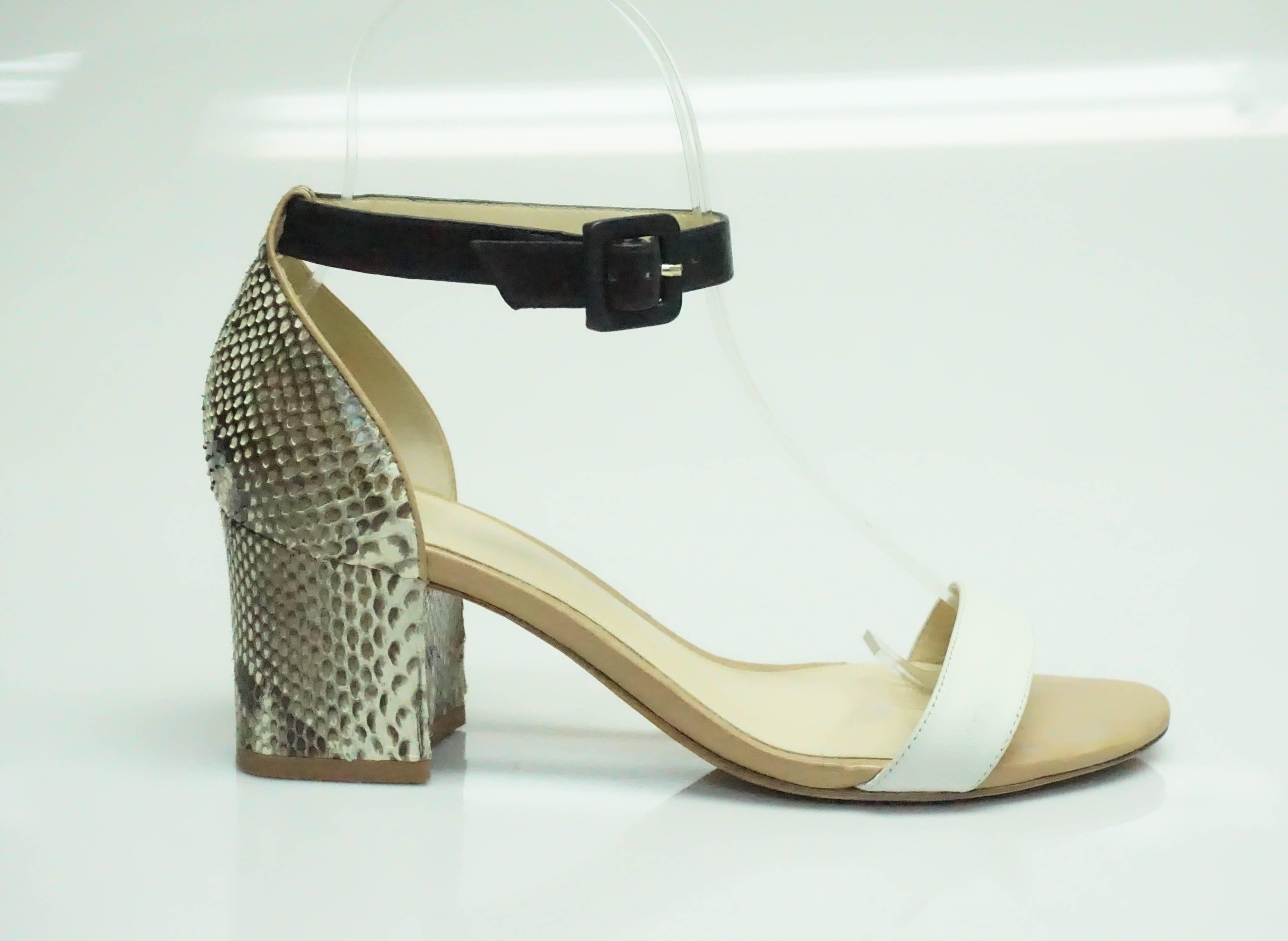 Alexandre Birman White & Earthtone Python Sandal - 36  These very elegant shoe is in excellent condition. The shoe is a nude color with a white front strap and a black ankle strap. The heel is a thick heel that is completely covered in python.  The