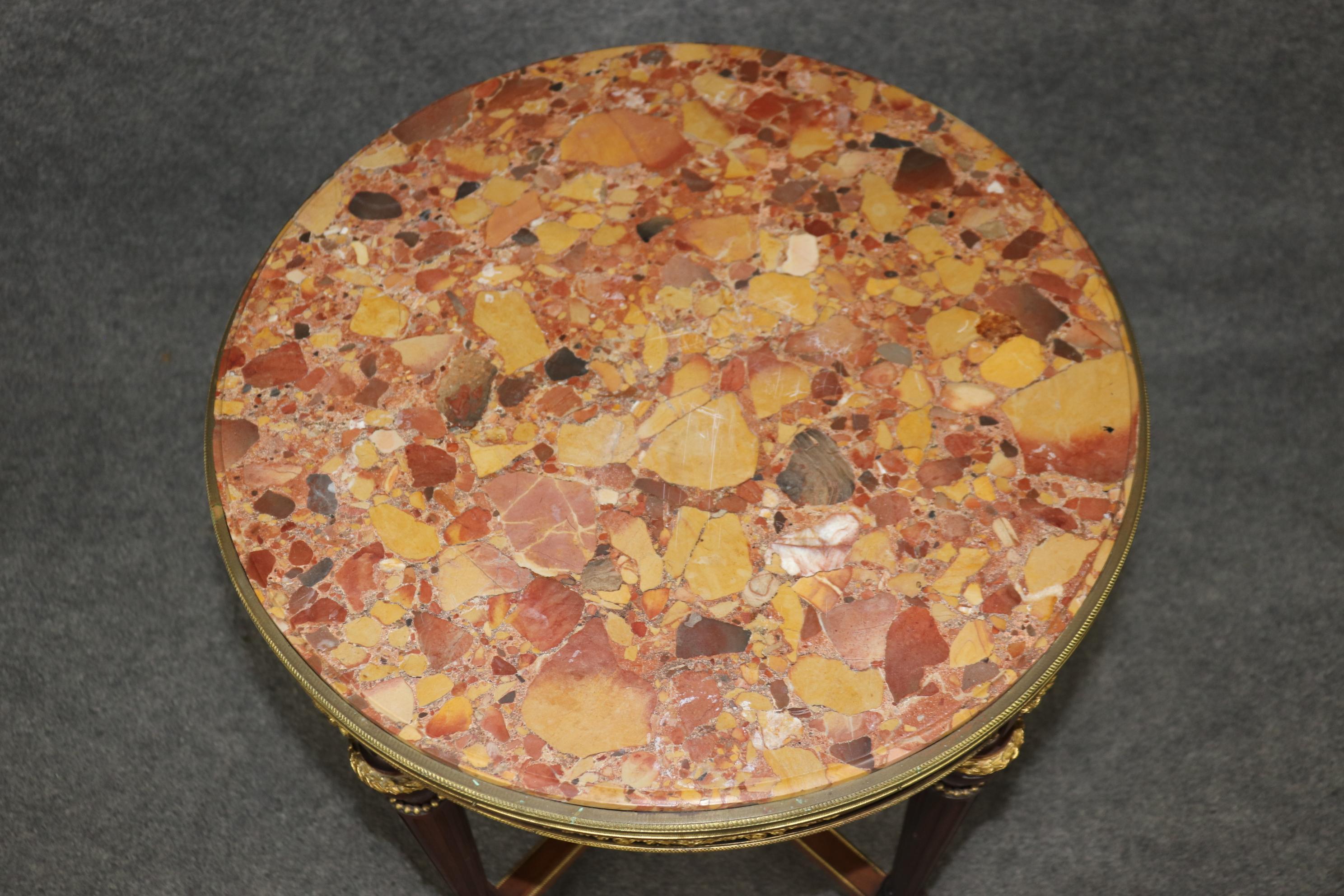  This is a rare table by Alexander Chevrie of Paris. The table is in very good condition for ots age and features rare breche d' alep marble and superb jewelery quality bronze castings and mounts. The table is signed and labeled. The table is a