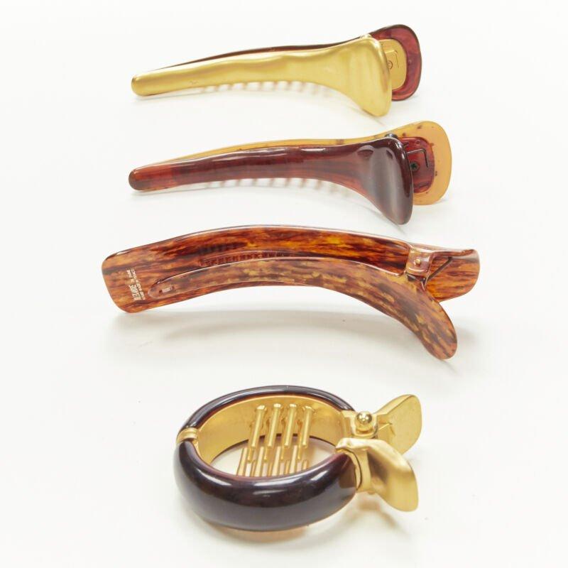 ALEXANDRE DE PARIS Alexander Zouari brown stone print acrylic hair clips X4
Reference: ANWU/A00198
Brand: Alexandre de Paris
Designer: Alexandre Zouari
Material: Acrylic, Metal
Color: Brown, Gold
Pattern: Solid
Closure: Clip On
Extra Details: 13cm