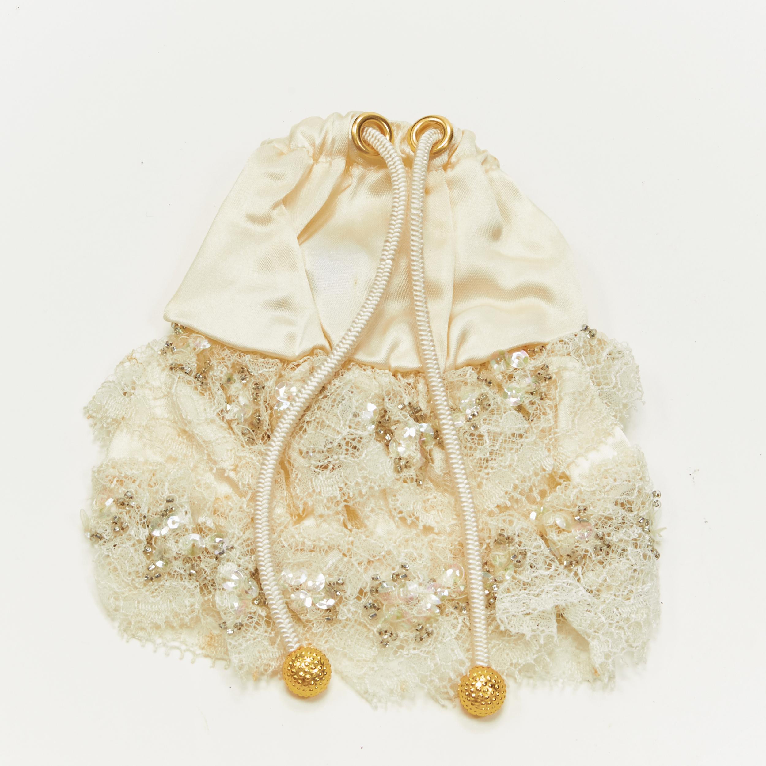 ALEXANDRE DE PARIS Alexander Zouari silver bead sequins lace pony tail scrunchie 
Reference: ANWU/A00200 
Brand: Alexandre de Paris 
Designer: Alexandre Zouari 
Material: Silk 
Color: Cream 
Pattern: Solid 
Closure: Drawstring 
Made in: France