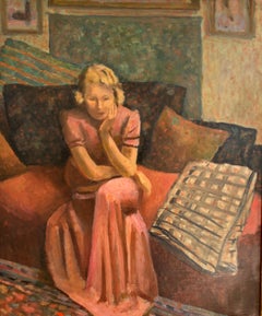Giovane donna seduta nello studio di un artista