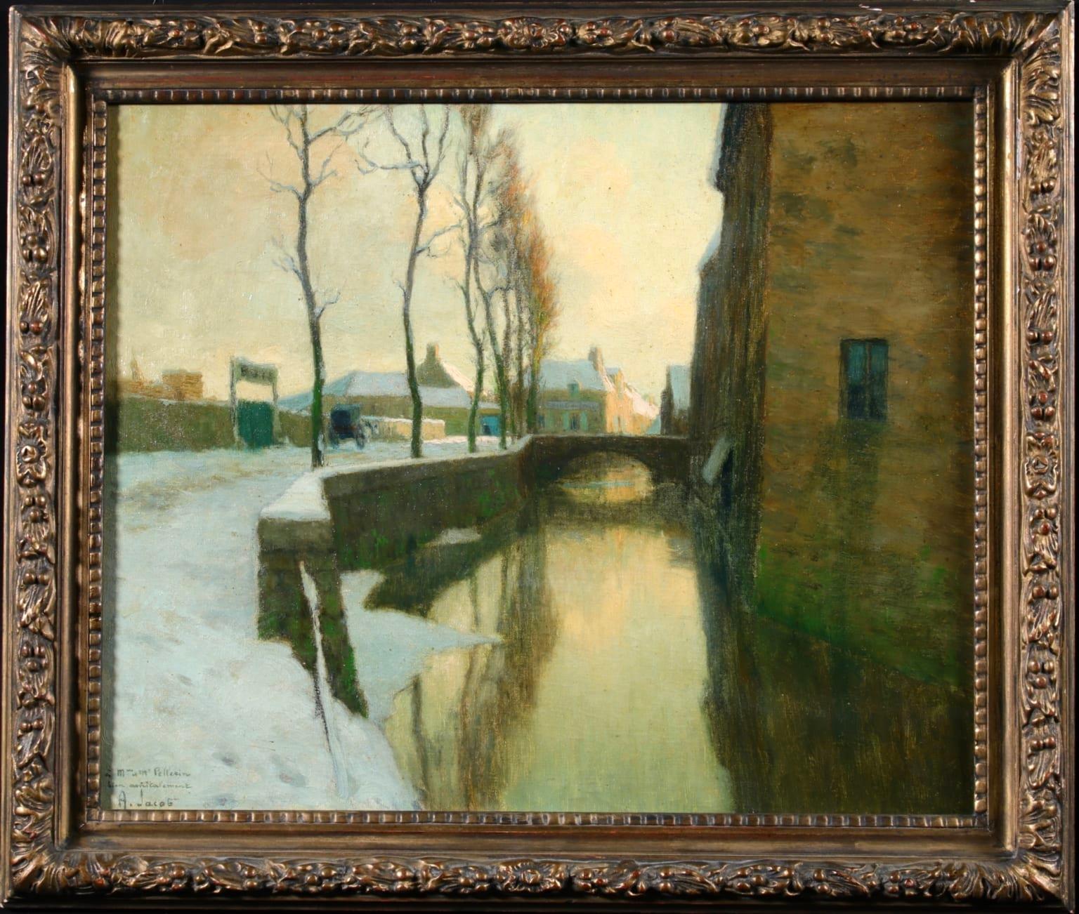 A wonderful oil on original canvas by French impressionist painter Alexandre Louis Jacob depicting a river running in between houses and a road, with bare trees beside it and a bridge over it. The scene is set in winter and snow coats the road and